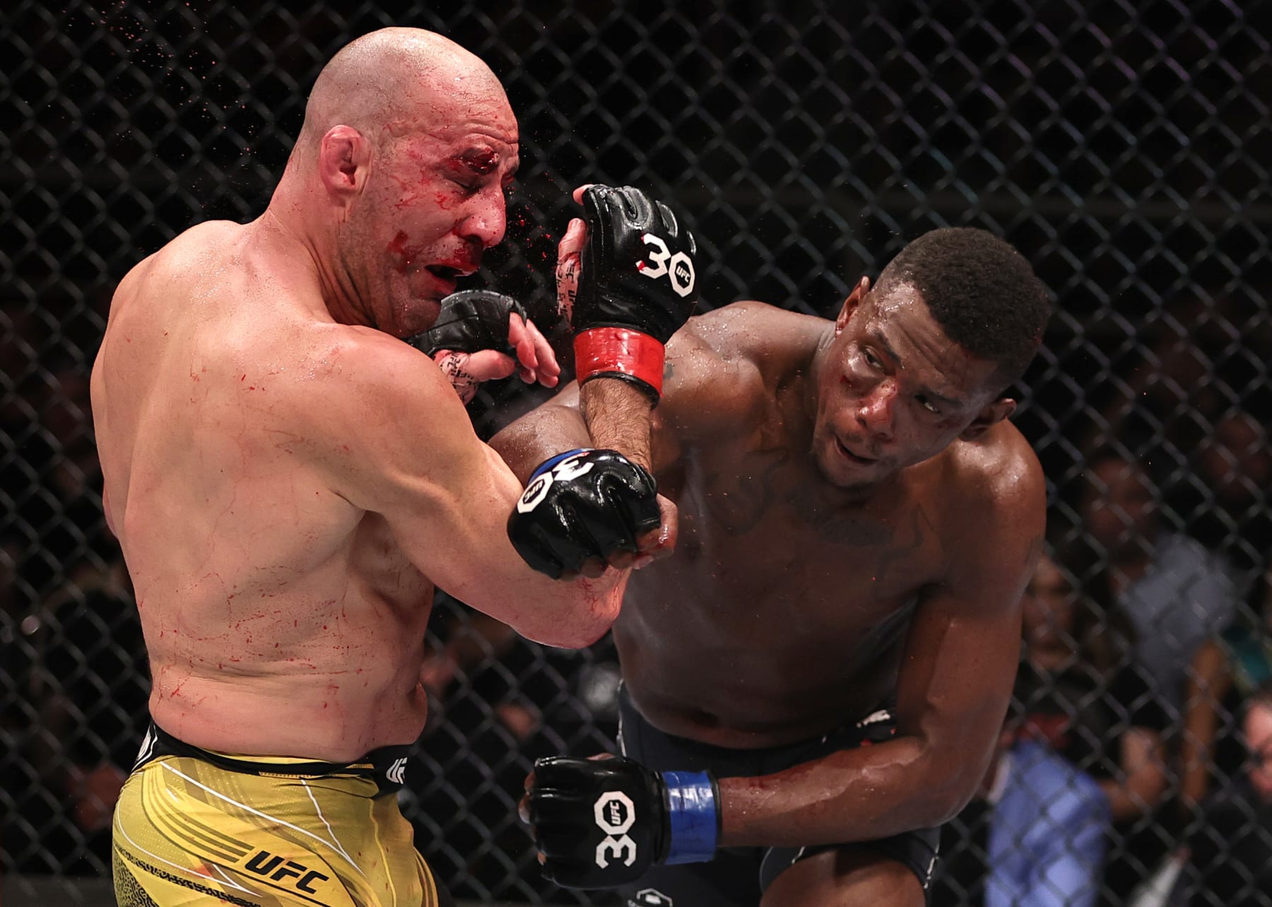 RIO DE JANEIRO, BRAZIL - JANUARY 21: (R-L) Jamahal Hill punches Glover Teixeira of Brazil in the UFC light heavyweight championship fight during the UFC 283 event at Jeunesse Arena on January 21, 2023 in Rio de Janeiro, Brazil. (Photo by Buda Mendes/Zuffa LLC via Getty Images)