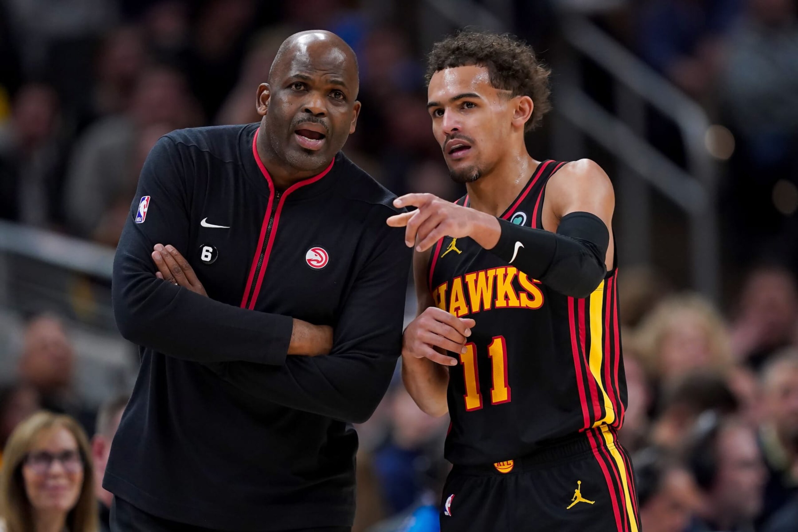 Nate McMillan (left), Trae Young (right).