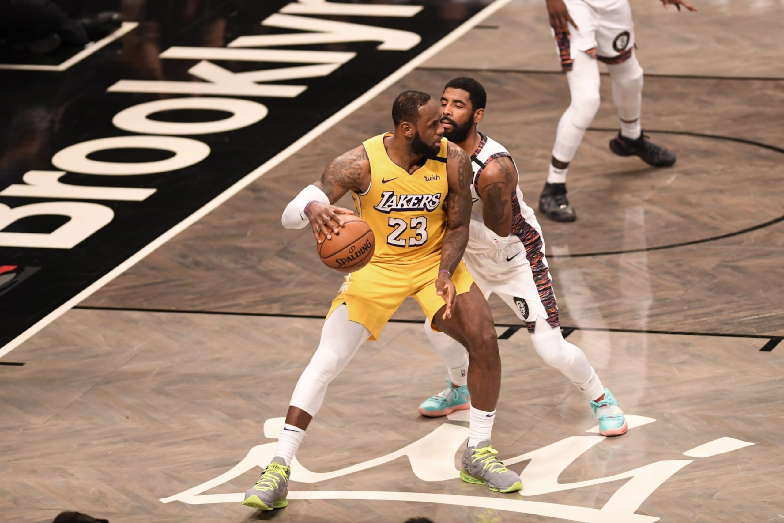 NEW YORK, NEW YORK - JANUARY 23: LeBron James #23 of the Los Angeles Lakers in action against Kyrie Irving #11 during the game against the Brooklyn Nets at Barclays Center on January 23, 2020 in New York City. NOTE TO USER: User expressly acknowledges and agrees that, by downloading and or using this photograph, User is consenting to the terms and conditions of the Getty Images License Agreement. (Photo by Matteo Marchi/Getty Images)