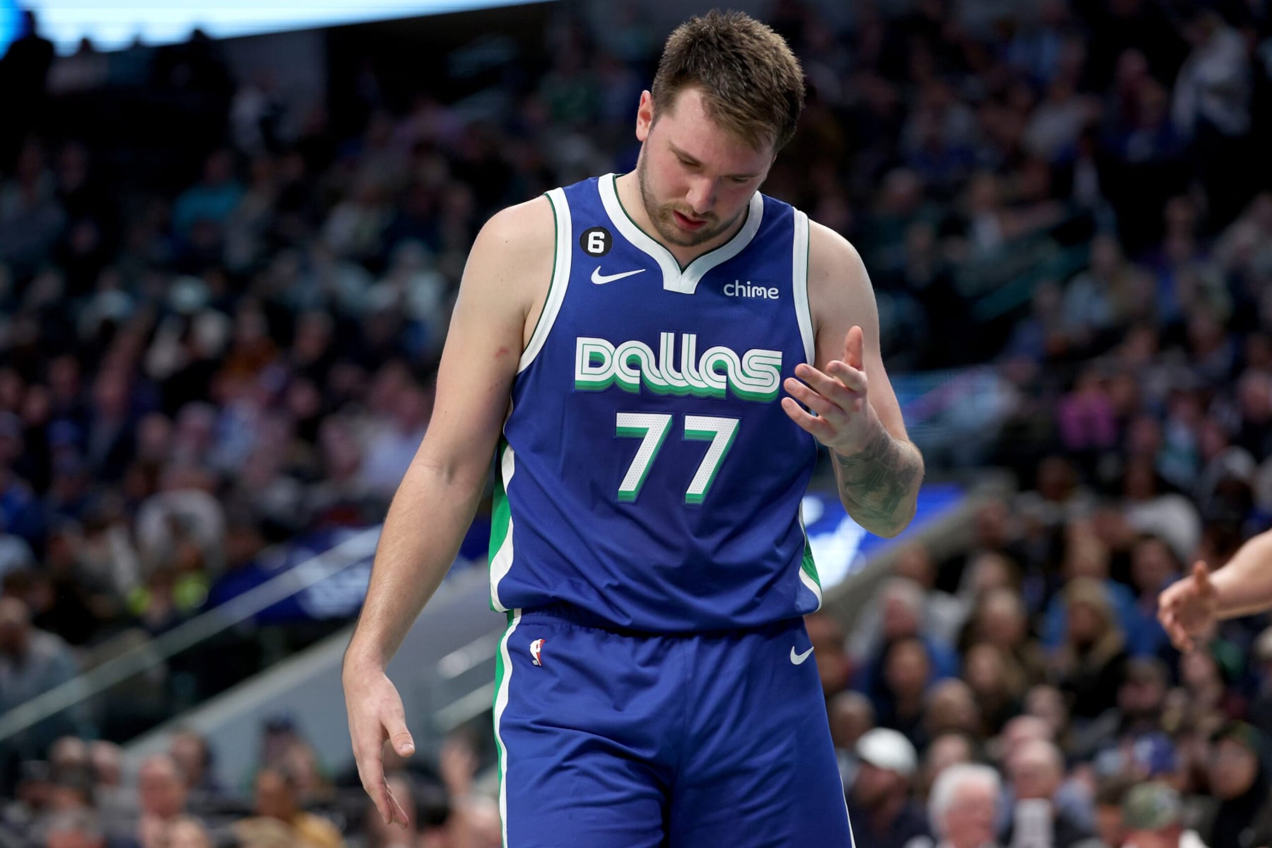 DALLAS, TEXAS - JANUARY 24: Luka Doncic #77 of the Dallas Mavericks reacts while taking on the Washington Wizards in the third quarter at American Airlines Center on January 24, 2023 in Dallas, Texas. NOTE TO USER: User expressly acknowledges and agrees that, by downloading and or using this photograph, User is consenting to the terms and conditions of the Getty Images License Agreement. (Photo by Tom Pennington/Getty Images)