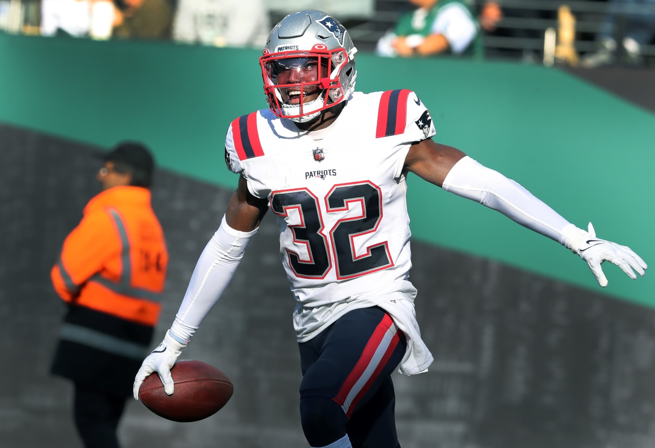 East Rutherford, NJ - October 30: New England Patriots S Devin McCourty smiles wide after his second interception of the day. The Patriots defeated the New York Jets, 22-17. (Photo by Jim Davis/The Boston Globe via Getty Images)