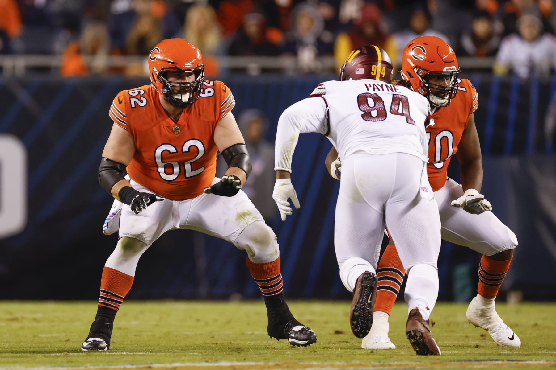 Chicago Bears guard Lucas Patrick (62) blocks against Washington Commanders defensive tackle Daron Payne (94) during the first half of an NFL football game, Thursday, Oct. 13, 2022, in Chicago. (AP Photo/Kamil Krzaczynski)