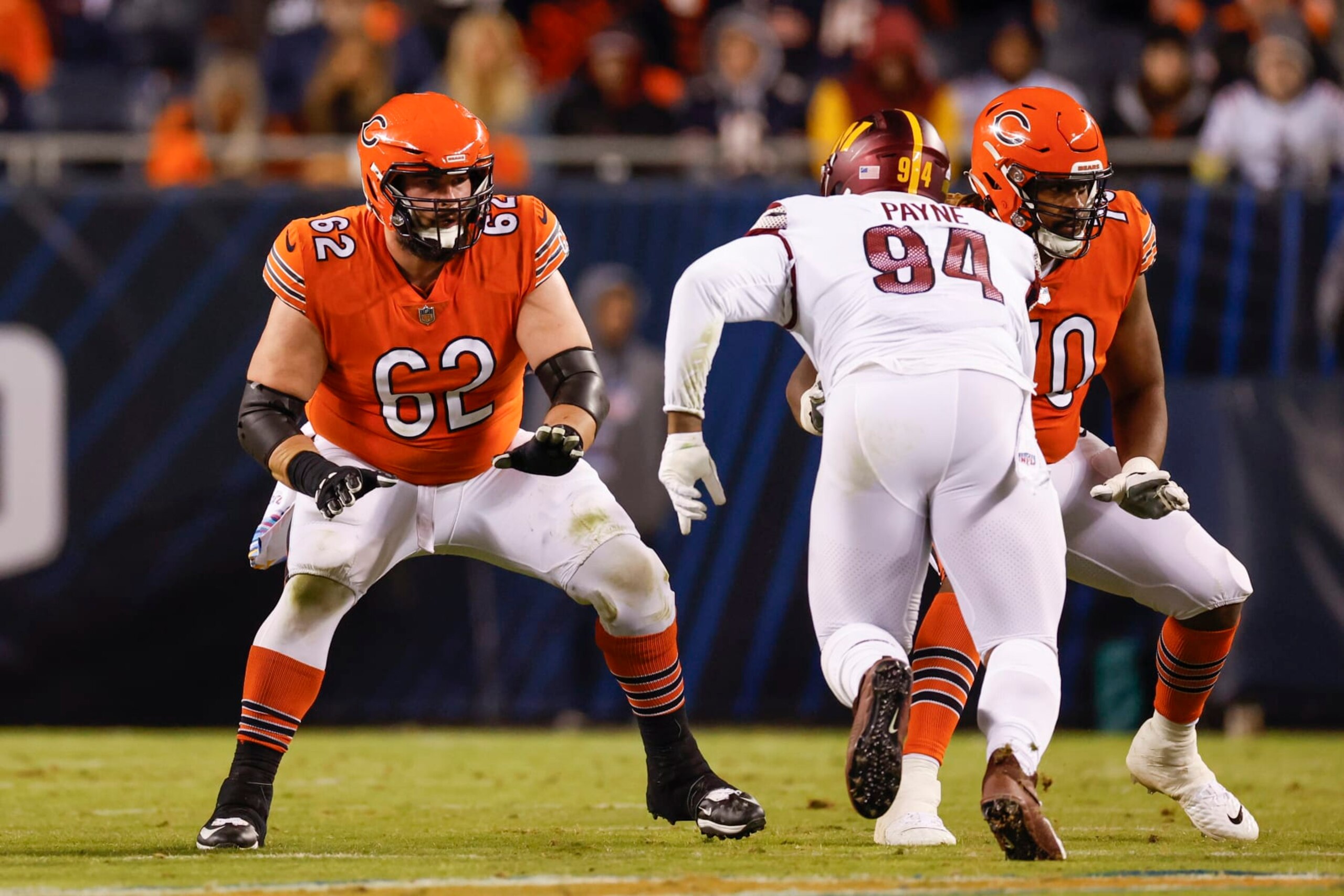 Chicago Bears guard Lucas Patrick (62) blocks against Washington Commanders defensive tackle Daron Payne (94) during the first half of an NFL football game, Thursday, Oct. 13, 2022, in Chicago. (AP Photo/Kamil Krzaczynski)