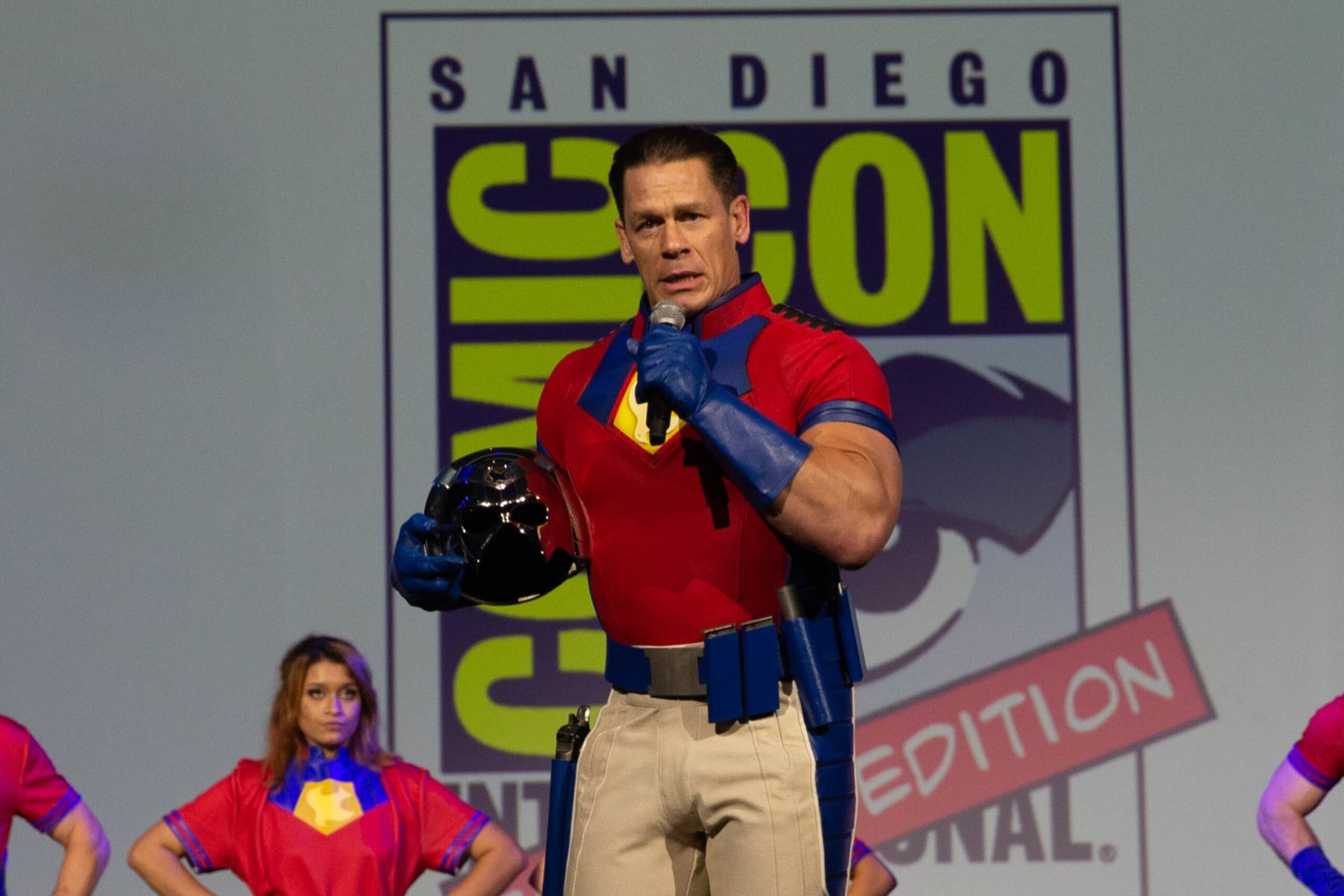 SAN DIEGO, CA - NOVEMBER 27: Actor John Cena surprises fans dressed as his character from HBO Max New Series “Peacemaker” during 2021 Comic-Con: Special Edition at the San Diego Convention Center on November 27, 2021 in San Diego, California. (Photo by Bill Watters/Getty Images)