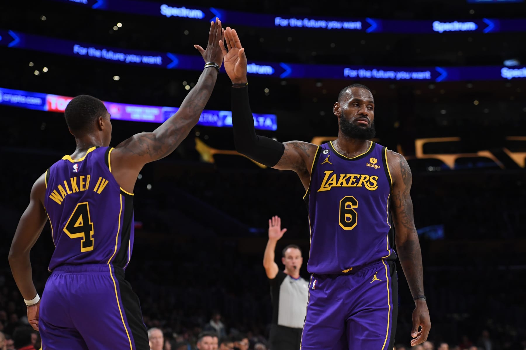 LOS ANGELES, CA - NOVEMBER 4: Lonnie Walker IV #4 and LeBron James #6 of the Los Angeles Lakers high five during the game against the Utah Jazz on November 4, 2022 at Crypto.Com Arena in Los Angeles, California. NOTE TO USER: User expressly acknowledges and agrees that, by downloading and/or using this Photograph, user is consenting to the terms and conditions of the Getty Images License Agreement. Mandatory Copyright Notice: Copyright 2022 NBAE (Photo by Juan Ocampo/NBAE via Getty Images)