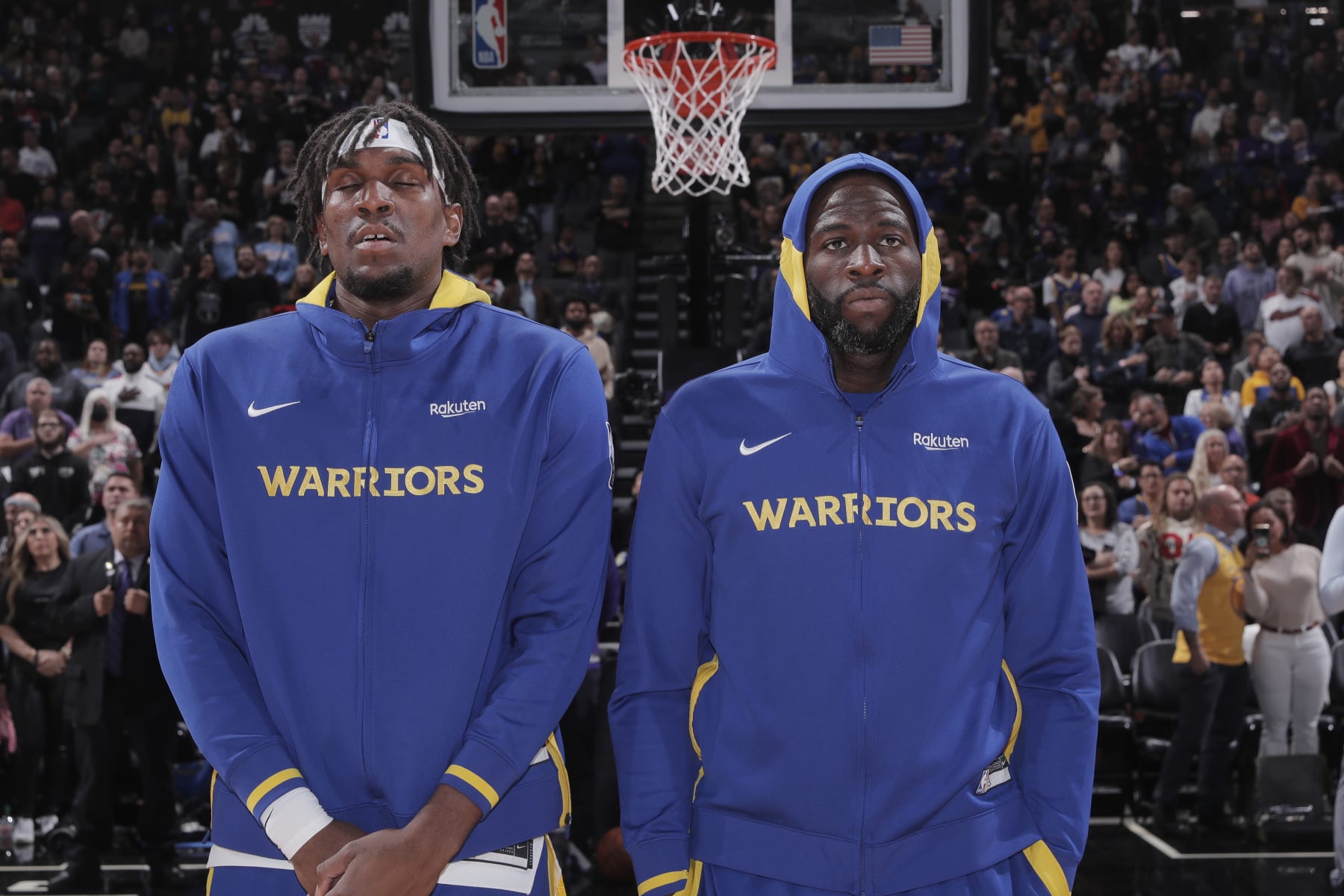 SACRAMENTO, CA - NOVEMBER 13: Kevon Looney #5 and Draymond Green #23 of the Golden State Warriors stand for the National Anthem prior to the game against the Sacramento Kings on November 13, 2022 at Golden 1 Center in Sacramento, California. NOTE TO USER: User expressly acknowledges and agrees that, by downloading and or using this photograph, User is consenting to the terms and conditions of the Getty Images Agreement. Mandatory Copyright Notice: Copyright 2022 NBAE (Photo by Rocky Widner/NBAE via Getty Images)