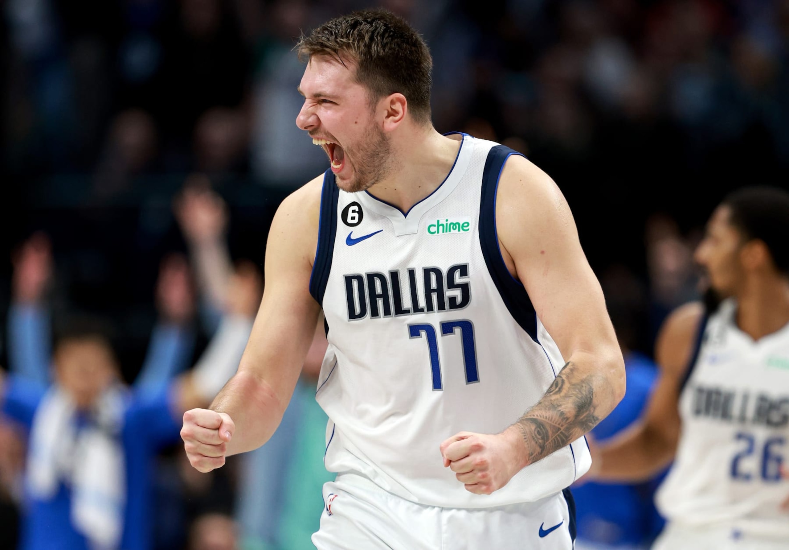 DALLAS, TEXAS - NOVEMBER 15: Luka Doncic #77 of the Dallas Mavericks celebrates after Spencer Dinwiddie #26 of the Dallas Mavericks hits a three-point shot against the LA Clippers in the fourth quarter at American Airlines Center on November 15, 2022 in Dallas, Texas. NOTE TO USER: User expressly acknowledges and agrees that, by downloading and or using this photograph, User is consenting to the terms and conditions of the Getty Images License Agreement. (Photo by Tom Pennington/Getty Images)