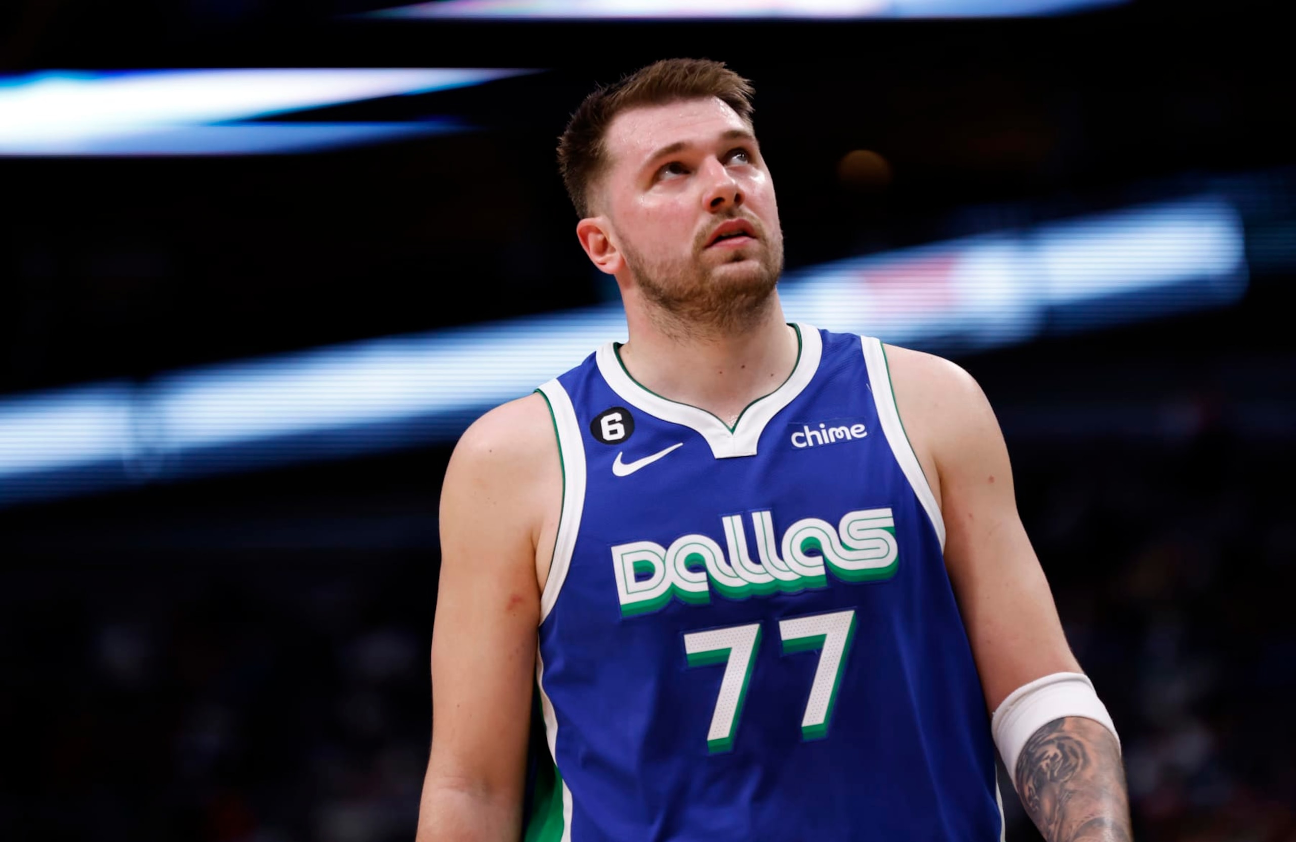 DALLAS, TX - JANUARY 30: Luka Doncic #77 of the Dallas Mavericks looks on against the Detroit Pistons in the second half at American Airlines Center on January 30, 2023 in Dallas, Texas. The Mavericks won 111-105. NOTE TO USER: User expressly acknowledges and agrees that, by downloading and or using this photograph, User is consenting to the terms and conditions of the Getty Images License Agreement. (Photo by Ron Jenkins/Getty Images)