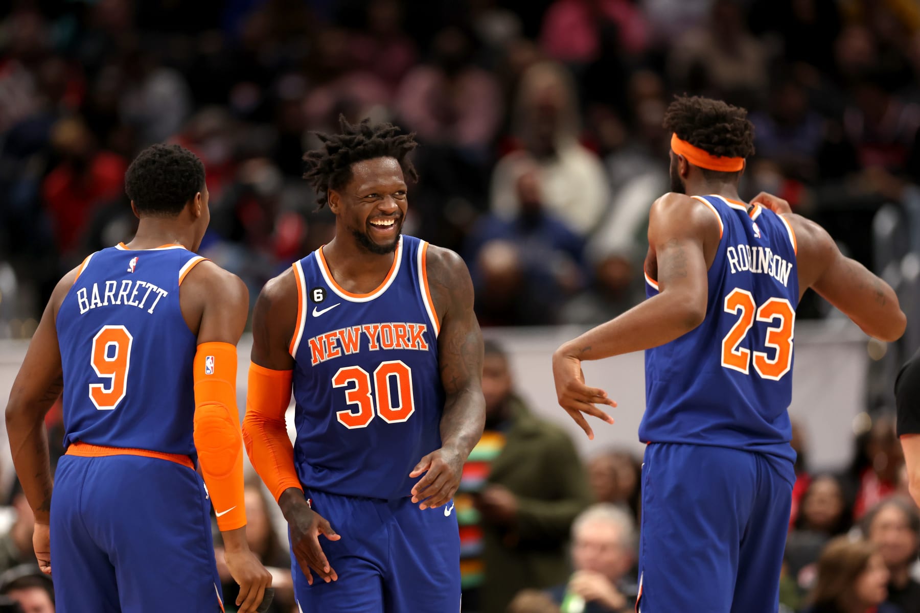 WASHINGTON, DC - JANUARY 13: Julius Randle #30 of the New York Knicks celebrates scoring with RJ Barrett #9 and Mitchell Robinson #23 of the New York Knicks in the second half against the Washington Wizards at Capital One Arena on January 13, 2023 in Washington, DC. NOTE TO USER: User expressly acknowledges and agrees that, by downloading and or using this photograph, User is consenting to the terms and conditions of the Getty Images License Agreement.  (Photo by Rob Carr/Getty Images)