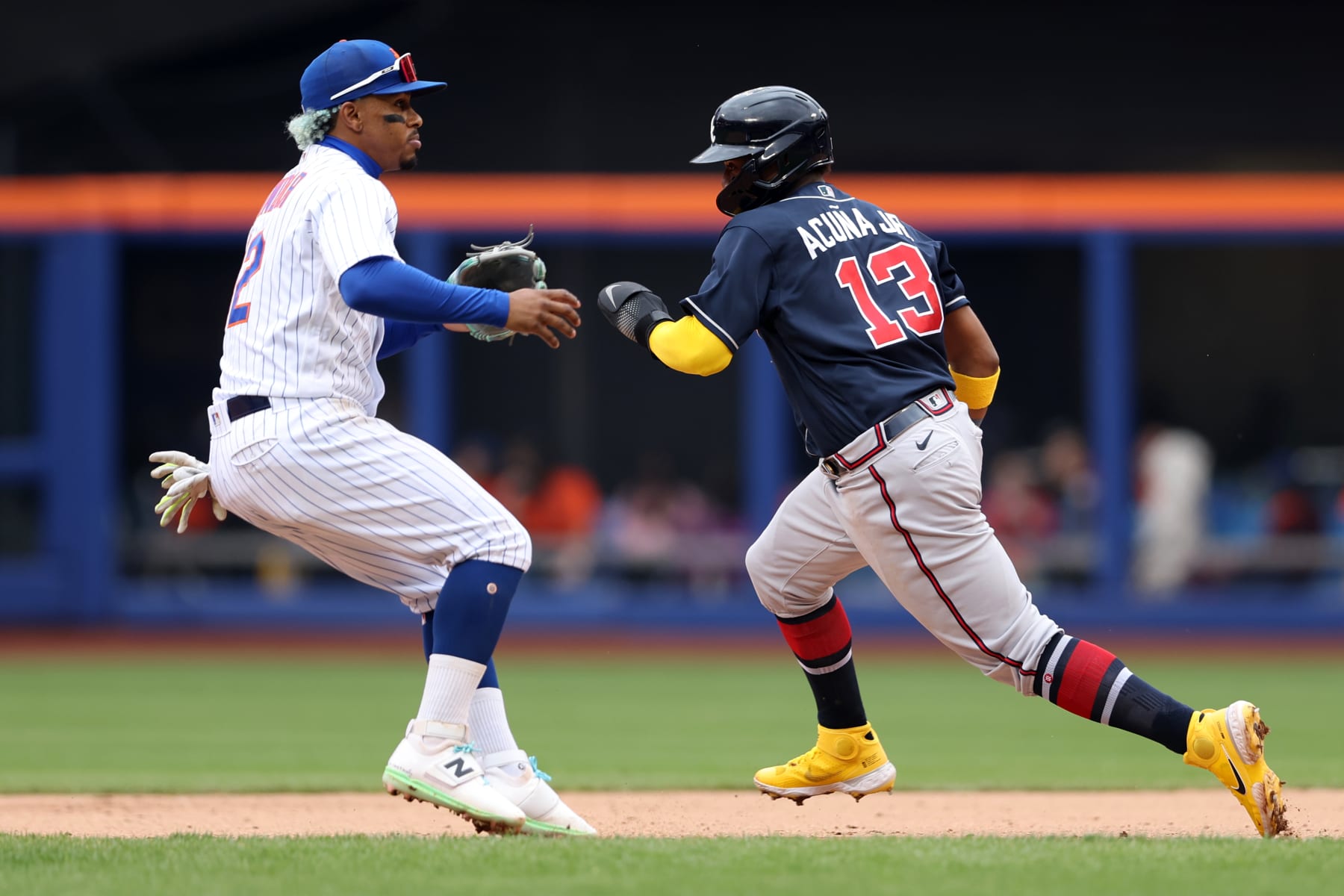 NEW YORK, NY - MAY 04: Ronald Acuna Jr. #13 of the Atlanta Braves runs past Francisco Lindor #12 of the New York Mets in a rundown in the sixth inning during the game between the Atlanta Braves and the New York Mets at Citi Field on Wednesday, May 4, 2022 in New York, New York. (Photo by Rob Tringali/MLB Photos via Getty Images)