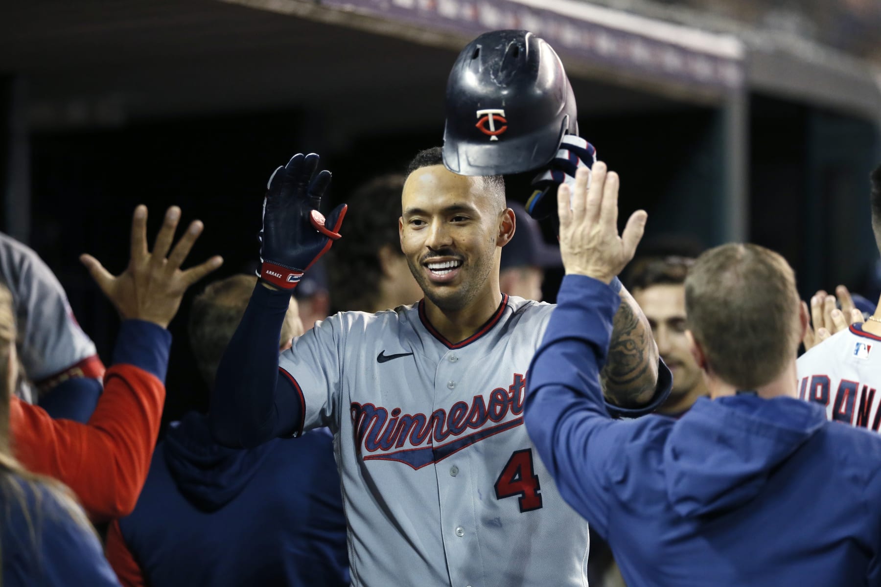 DETROIT, MI -  SEPTEMBER 30:  Carlos Correa #4 of the Minnesota Twins celebrates with teammates in the dugout after hitting a two-run home run against the Detroit Tigers during the seventh inning at Comerica Park on September 30, 2022, in Detroit, Michigan. (Photo by Duane Burleson/Getty Images)
