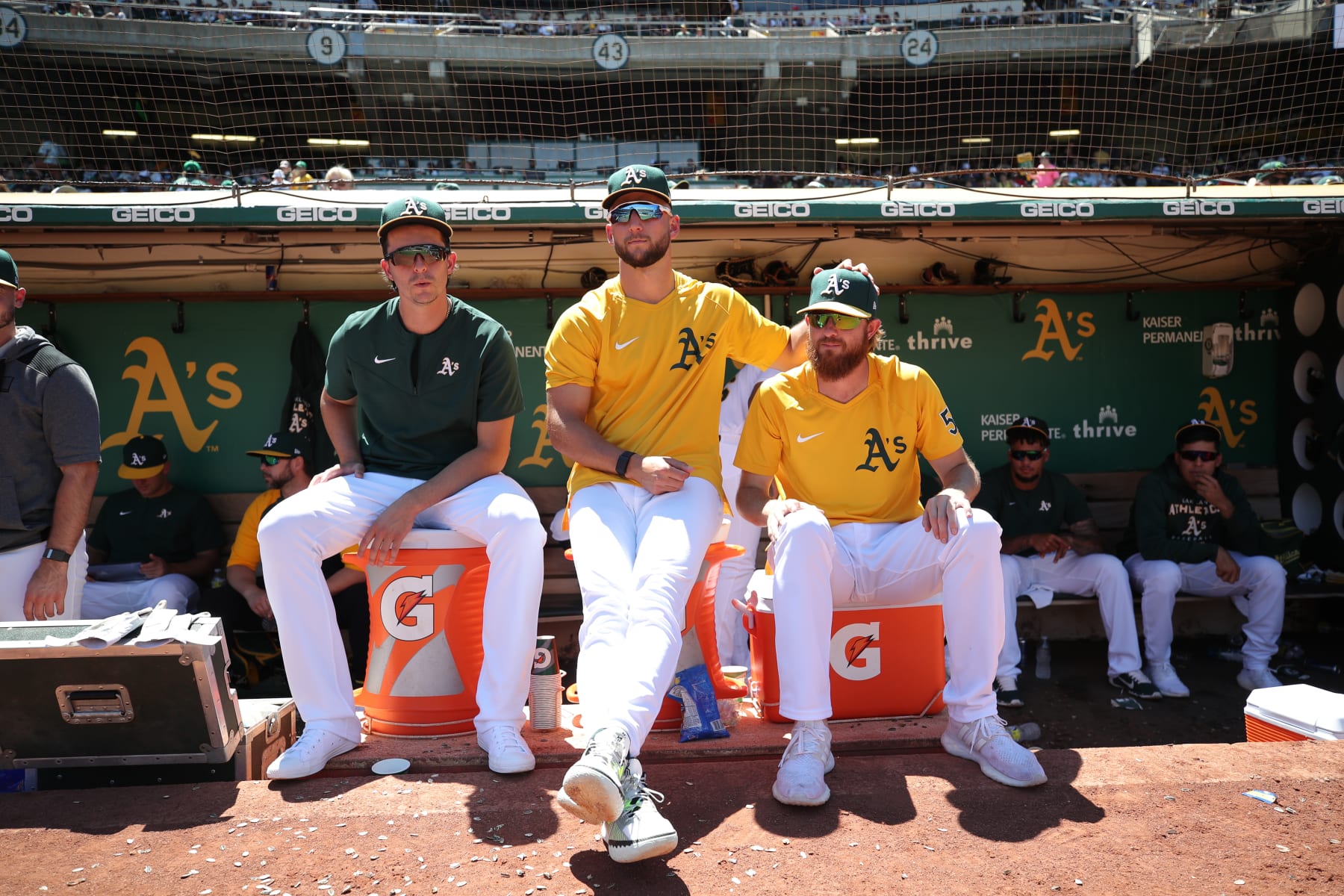 OAKLAND, CA - JULY 10: Brent Honeywell Jr. #45, James Kaprielian #32 and Paul Blackburn #58 of the Oakland Athletics in the dugout during the game against the Houston Astros at RingCentral Coliseum on July 10, 2022 in Oakland, California. The Astros defeated the Athletics 6-1. (Photo by Michael Zagaris/Oakland Athletics/Getty Images)