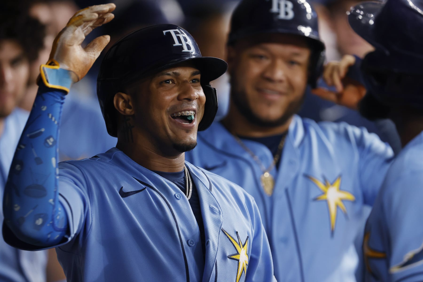Tampa Bay Rays' Wander Franco smiles in the dugout after scoring against the Toronto Blue Jays during the fifth inning of a baseball game Friday, Sept. 23, 2022, in St. Petersburg, Fla. (AP Photo/Scott Audette)