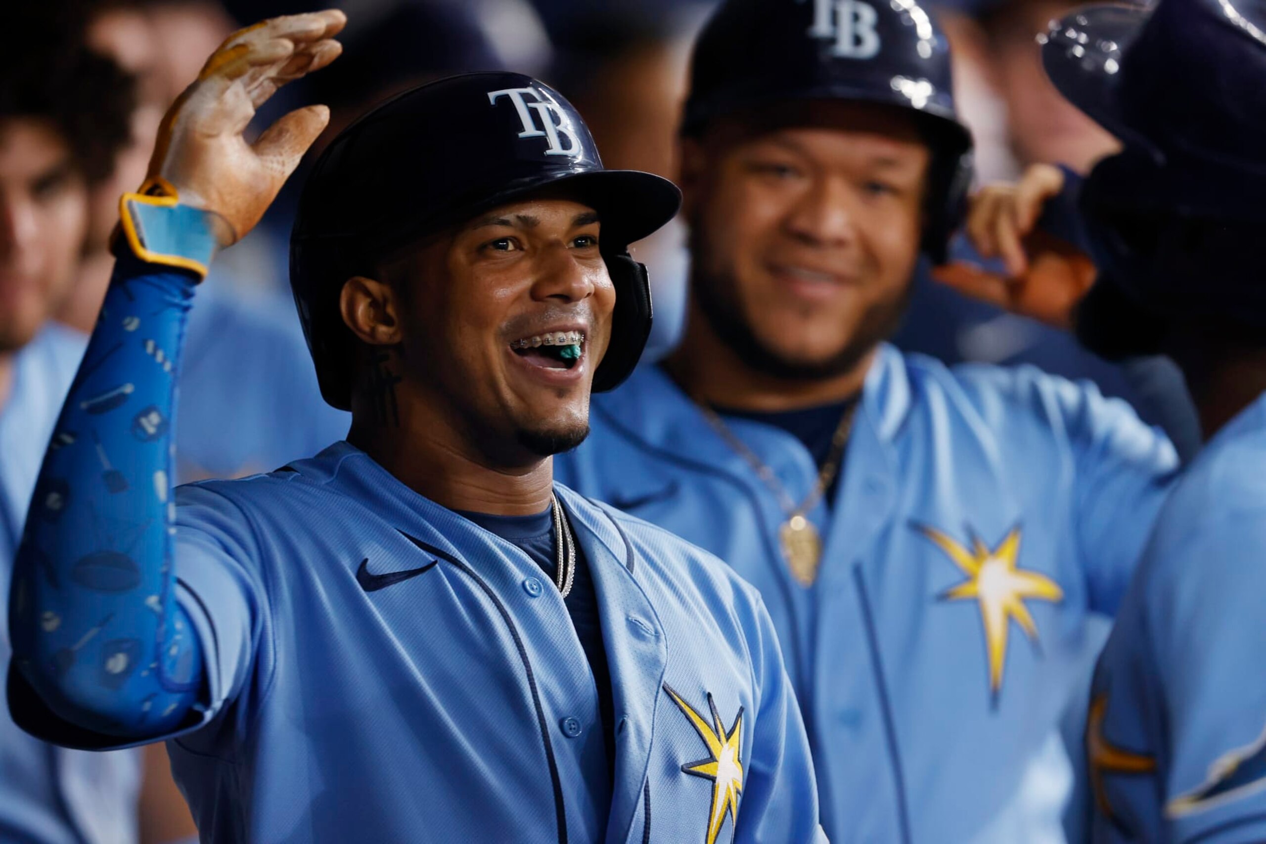 Tampa Bay Rays' Wander Franco smiles in the dugout after scoring against the Toronto Blue Jays during the fifth inning of a baseball game Friday, Sept. 23, 2022, in St. Petersburg, Fla. (AP Photo/Scott Audette)