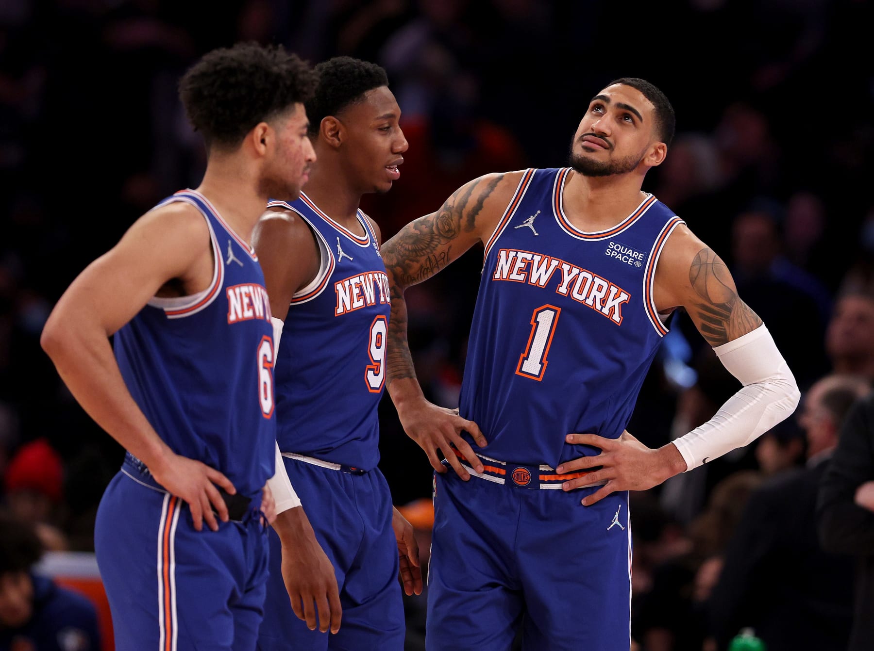 NEW YORK, NEW YORK - JANUARY 12:  Obi Toppin #1 of the New York Knicks looks up at the scoreboard late in the fourth quarter against the Dallas Mavericks as he stands by teammates Quentin Grimes #6 and RJ Barrett #9 at Madison Square Garden on January 12, 2022 in New York City. NOTE TO USER: User expressly acknowledges and agrees that, by downloading and or using this photograph, User is consenting to the terms and conditions of the Getty Images License Agreement. (Photo by Elsa/Getty Images)
