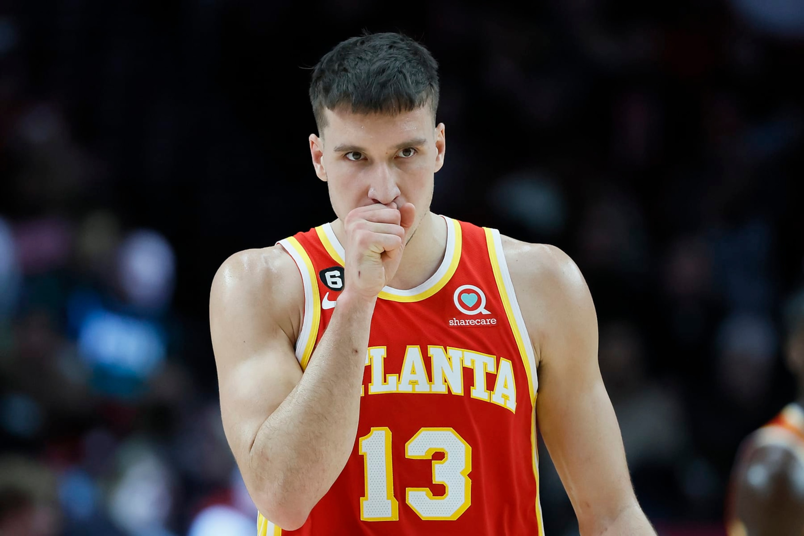 PORTLAND, OREGON - JANUARY 30: Bogdan Bogdanovic #13 of the Atlanta Hawks looks on during the first half against the Portland Trail Blazers at Moda Center on January 30, 2023 in Portland, Oregon. NOTE TO USER: User expressly acknowledges and agrees that, by downloading and or using this photograph, User is consenting to the terms and conditions of the Getty Images License Agreement. (Photo by Soobum Im/Getty Images) PORTLAND, OREGON - JANUARY 30: Bogdan Bogdanovic #13 of the Atlanta Hawks looks on during the first half against the Portland Trail Blazers at Moda Center on January 30, 2023 in Portland, Oregon. NOTE TO USER: User expressly acknowledges and agrees that, by downloading and or using this photograph, User is consenting to the terms and conditions of the Getty Images License Agreement. (Photo by Soobum Im/Getty Images)