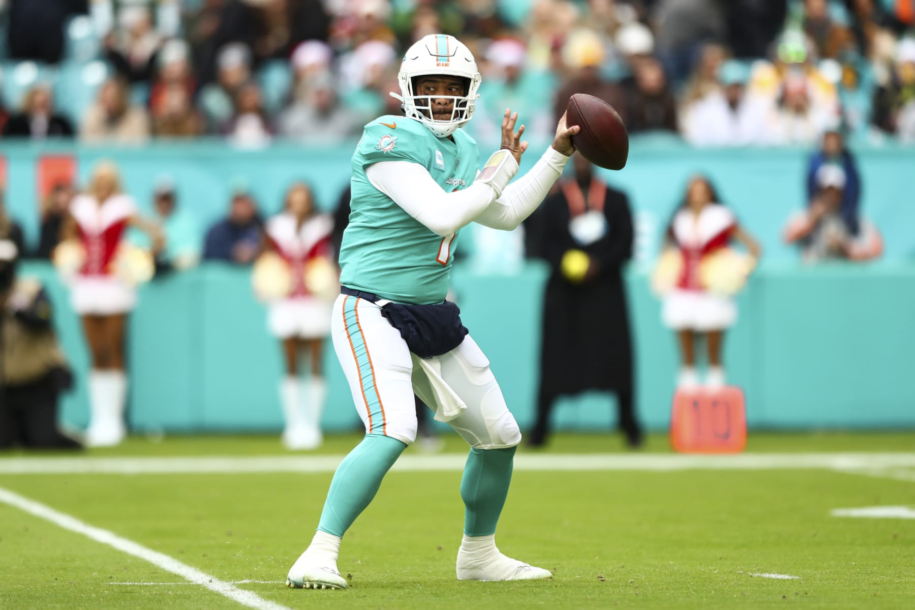 MIAMI GARDENS, FL - DECEMBER 25: Tua Tagovailoa #1 of the Miami Dolphins throws a pass during the first quarter of an NFL football game against the Green Bay Packers at Hard Rock Stadium on December 25, 2022 in Miami Gardens, Florida. (Photo by Kevin Sabitus/Getty Images)