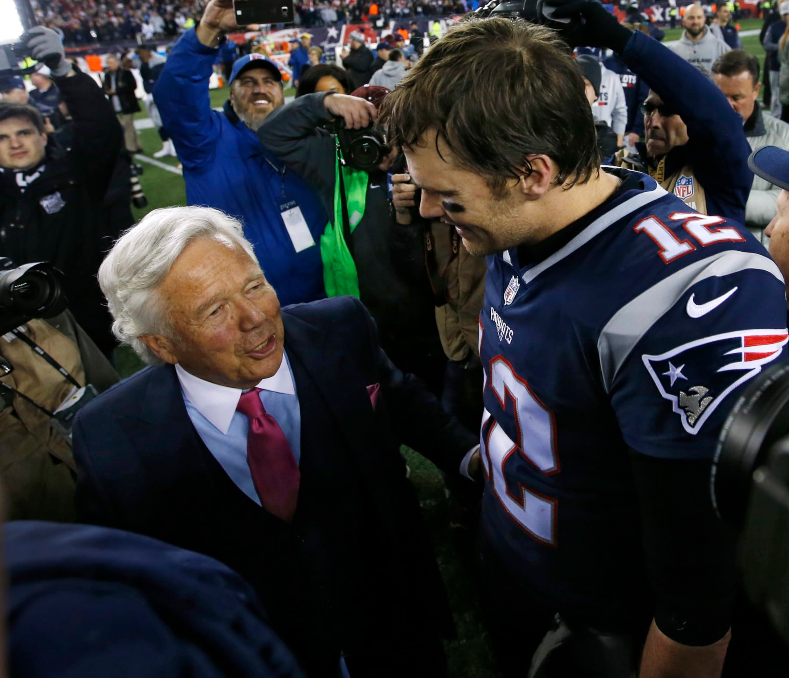 New England Patriots quarterback Tom Brady and owner Robert Kraft talk after the AFC Championship NFL football game against the Jacksonville Jaguars at Gillette Stadium in Foxborough, Mass. Sunday, Jan. 21, 2018. (AP Photo/Winslow Townson)