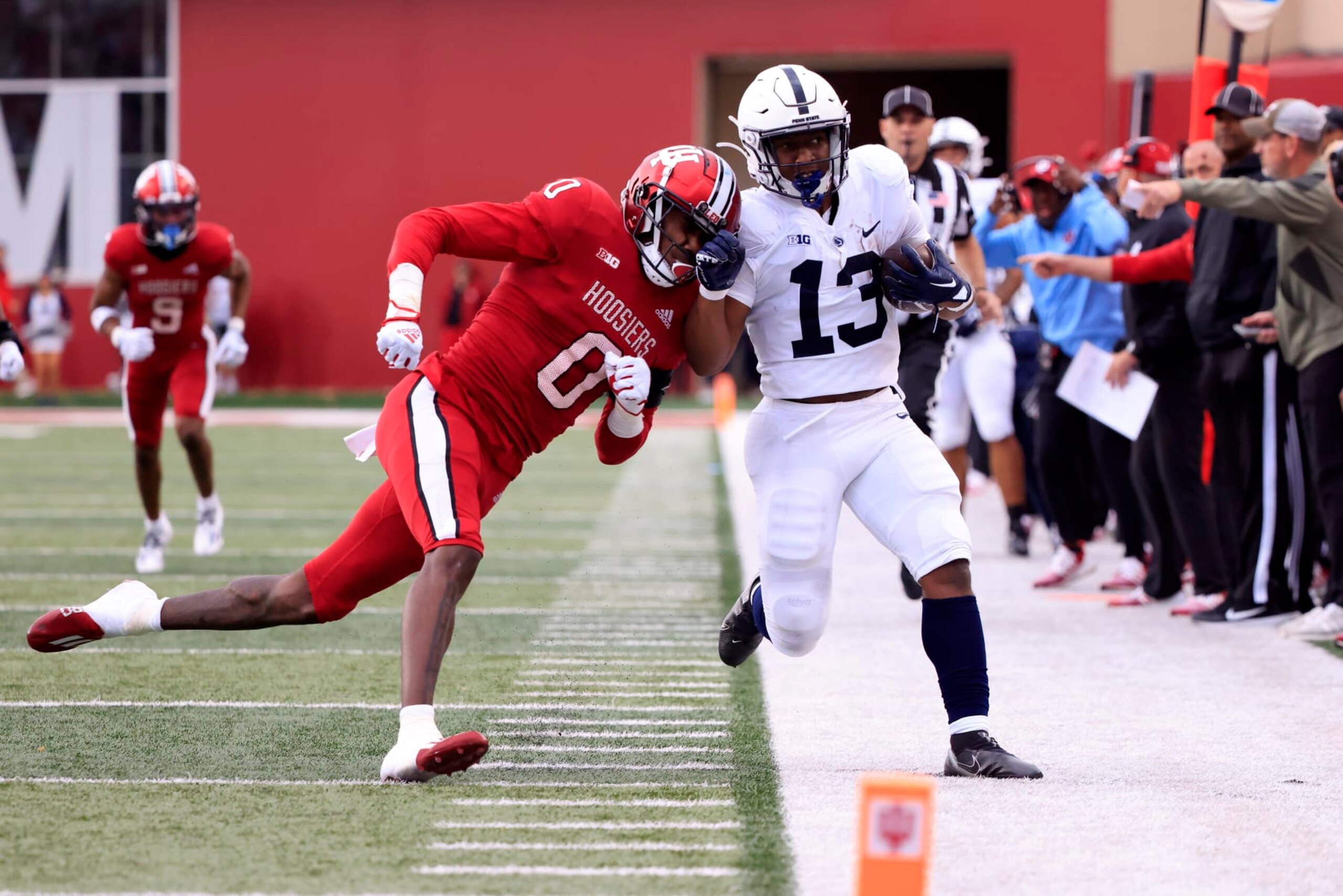 BLOOMINGTON, INDIANA - NOVEMBER 05: Kayton Allen #13 of the Penn State Nittany Lions is pushed out of bounds by Dasan McCullough #0 of the Indiana Hoosiers at Memorial Stadium on November 05, 2022 in Bloomington, Indiana. (Photo by Justin Casterline/Getty Images)