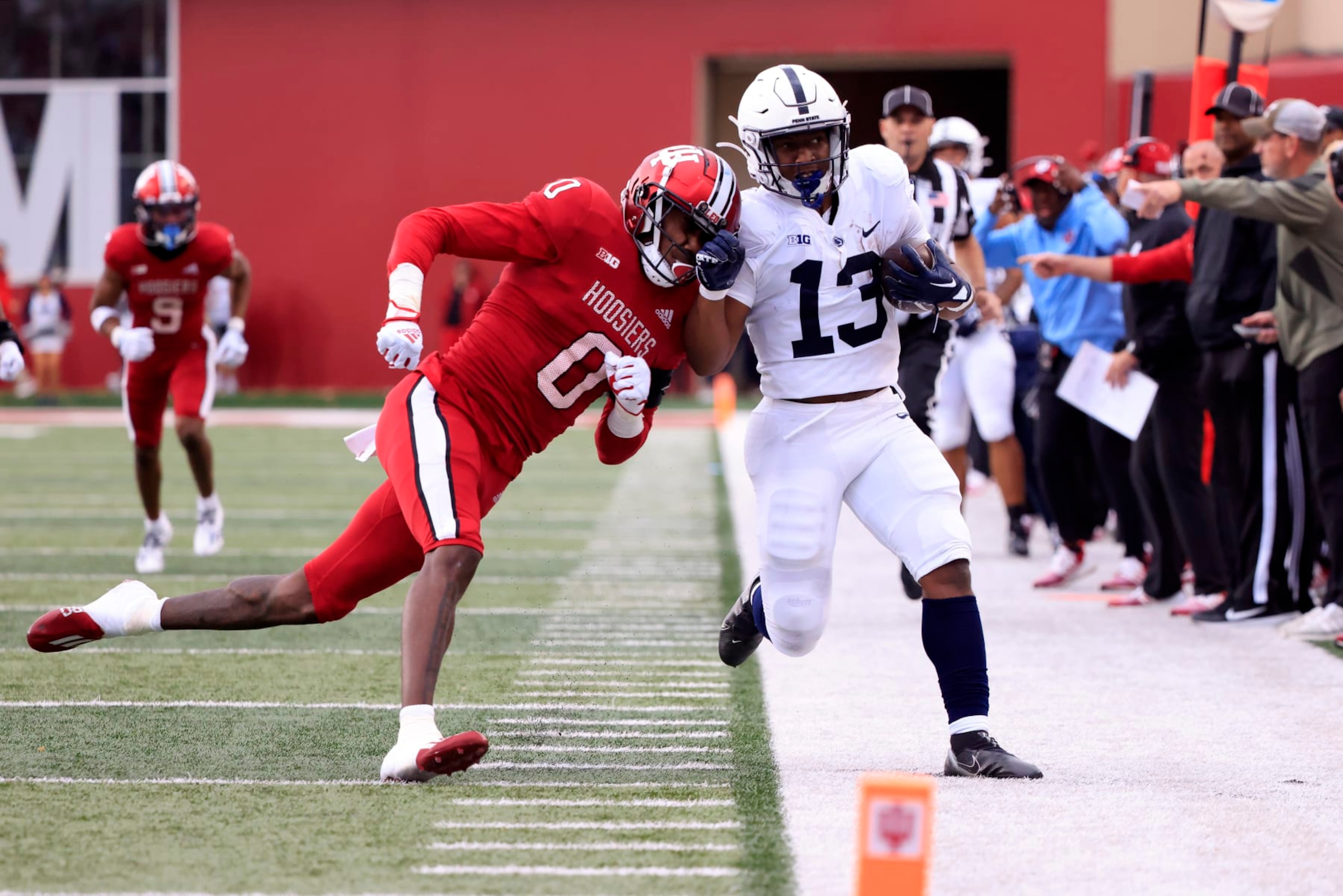 BLOOMINGTON, INDIANA - NOVEMBER 05: Kayton Allen #13 of the Penn State Nittany Lions is pushed out of bounds by Dasan McCullough #0 of the Indiana Hoosiers at Memorial Stadium on November 05, 2022 in Bloomington, Indiana. (Photo by Justin Casterline/Getty Images)