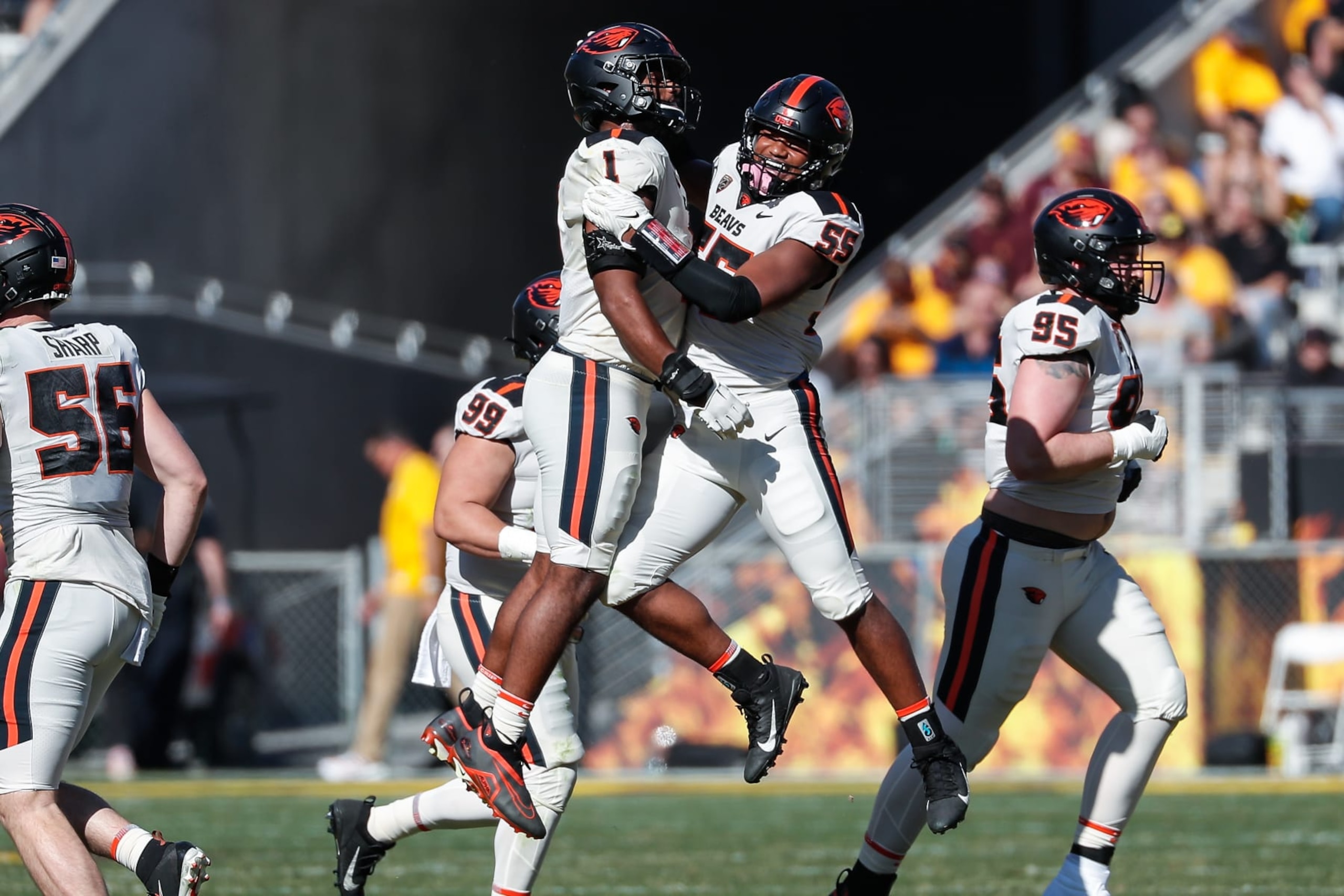TEMPE, AZ - NOVEMBER 19: Oregon State Beavers linebacker Easton Mascarenas-Arnold (55) and Oregon State Beavers linebacker Omar Speights (1) celebrate a big play during the college football game between the Oregon State Beavers and the Arizona State Sun Devils on November 19, 2022 at Sun Devil Stadium in Tempe, Arizona. (Photo by Kevin Abele/Icon Sportswire via Getty Images)