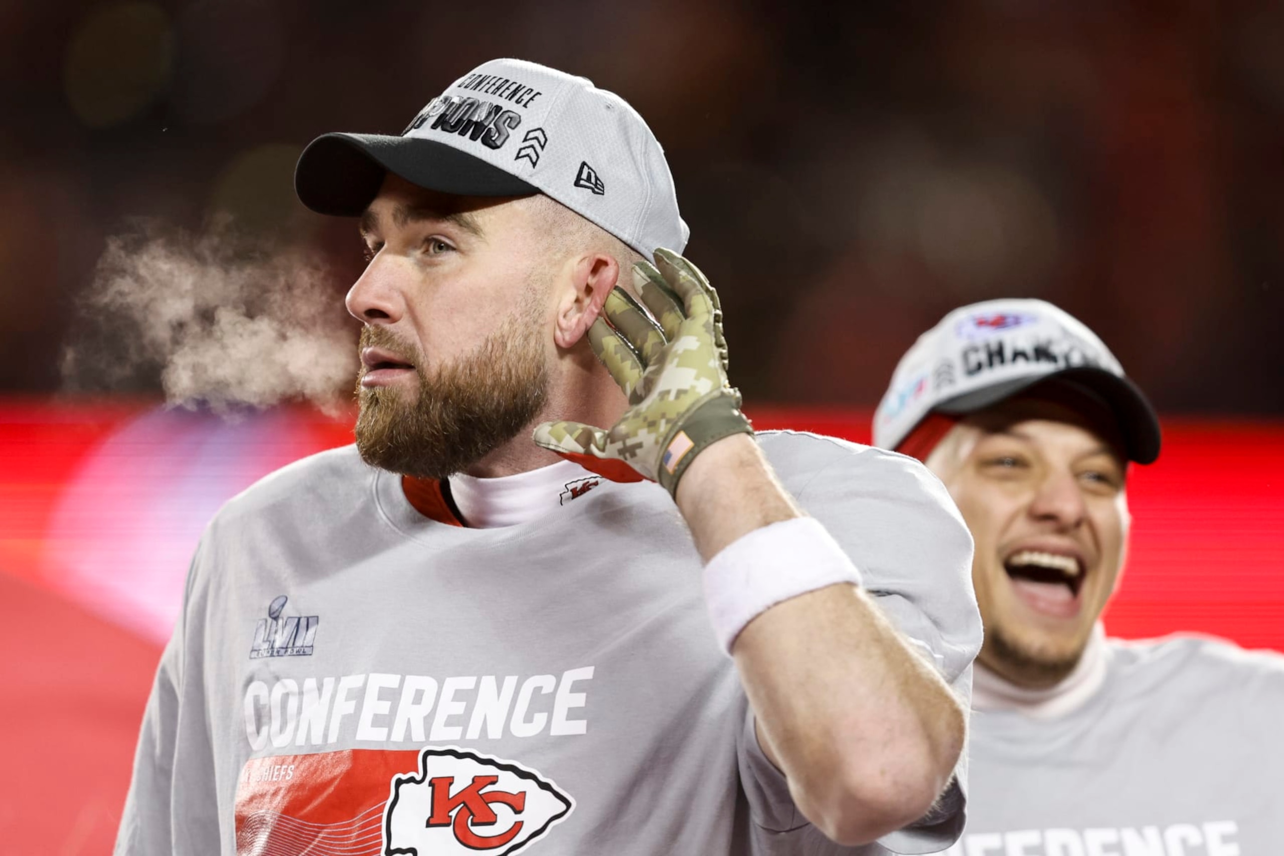 KANSAS CITY, MISSOURI - JANUARY 29: Travis Kelce #87 of the Kansas City Chiefs and Patrick Mahomes #15 of the Kansas City Chiefs celebrate with the Lamar Hunt Trophy after winning the AFC Championship NFL football game between the Kansas City Chiefs and the Cincinnati Bengals at GEHA Field at Arrowhead Stadium on January 29, 2023 in Kansas City, Missouri. (Photo by Michael Owens/Getty Images)