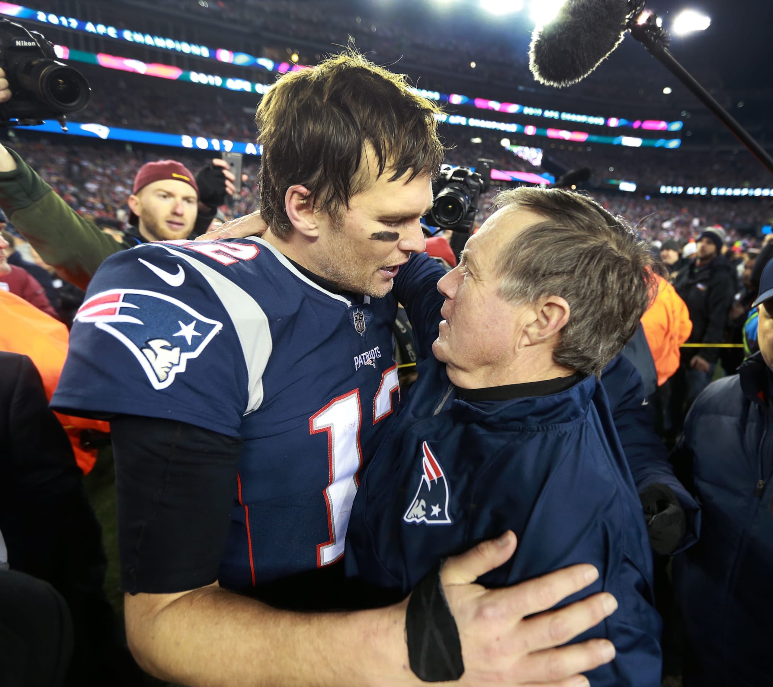 FOXBOROUGH, MA - JANUARY 21: New England Patriots quarterback Tom Brady and head coach Bill Belichick embrace following New England's victory. The New England Patriots host the Jacksonville Jaguars in an NFL AFC championship game at Gillette Stadium in Foxborough, MA on Jan. 21, 2018. (Photo by Jim Davis/The Boston Globe via Getty Images)