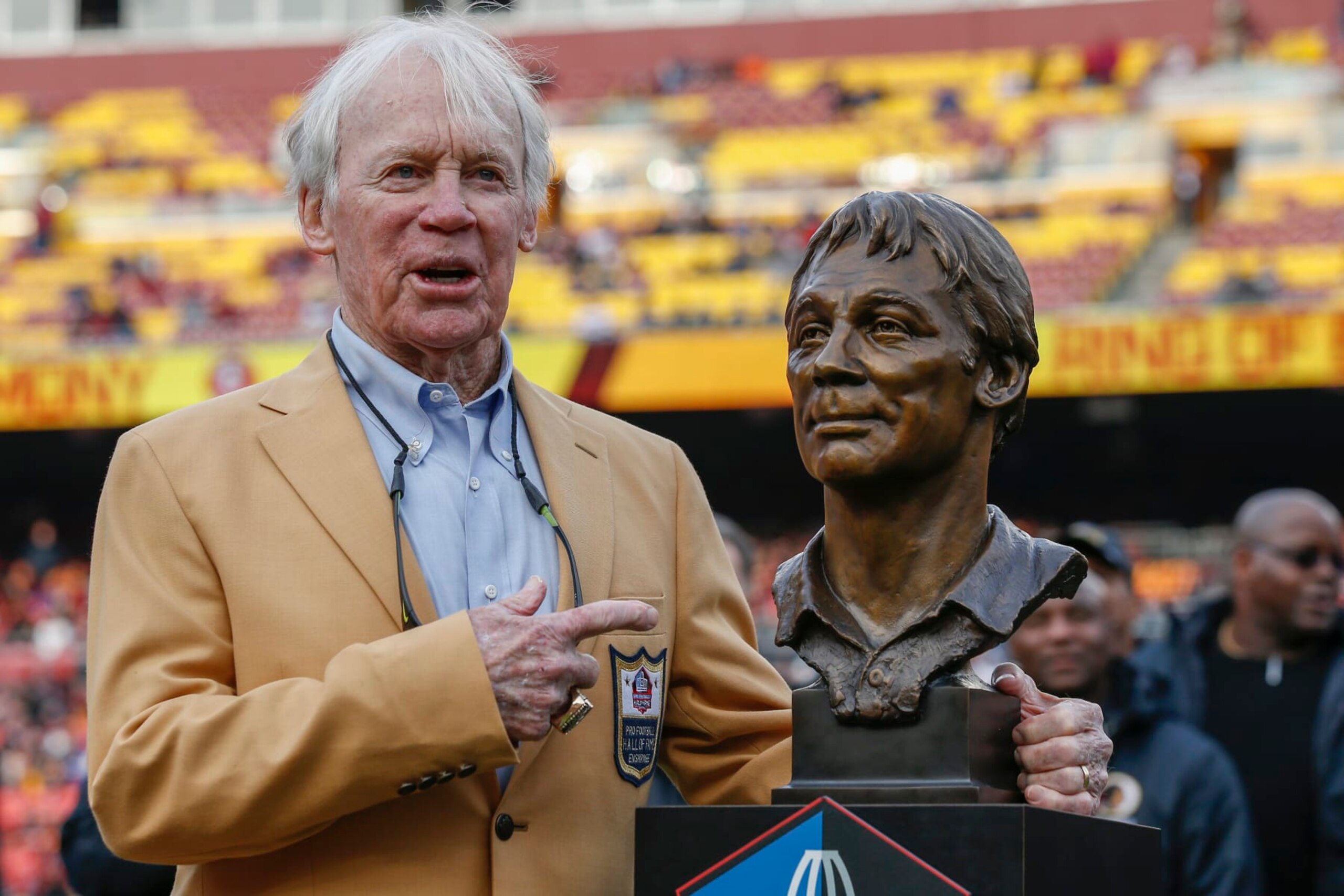 Former Washington Redskins general manager Bobby Beathard poses with his Hall of Fame trophy during halftime of an NFL football game between the Houston Texans and the Redskins, Sunday, Nov. 18, 2018 in Landover, Md. (AP Photo/Alex Brandon)