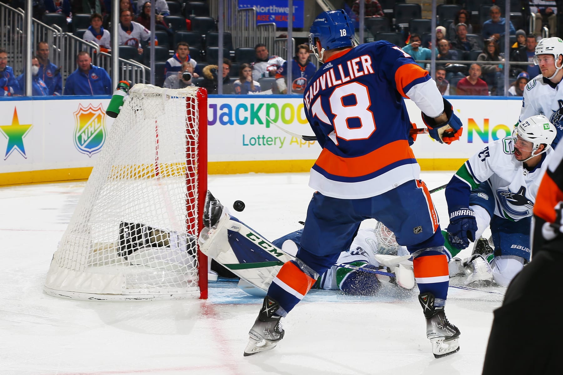 ELMONT, NEW YORK - MARCH 03: Anthony Beauvillier #18 of the New York Islanders scores a third period goal against the Vancouver Canucks at UBS Arena on March 03, 2022 in Elmont, New York. (Photo by Mike Stobe/NHLI via Getty Images)