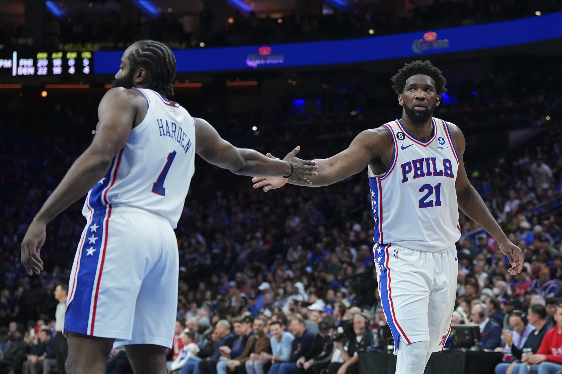 PHILADELPHIA, PA - JANUARY 28: James Harden #1 of the Philadelphia 76ers celebrates with Joel Embiid #21 against the Denver Nuggets at the Wells Fargo Center on January 28, 2023 in Philadelphia, Pennsylvania. NOTE TO USER: User expressly acknowledges and agrees that, by downloading and or using this photograph, User is consenting to the terms and conditions of the Getty Images License Agreement. (Photo by Mitchell Leff/Getty Images)