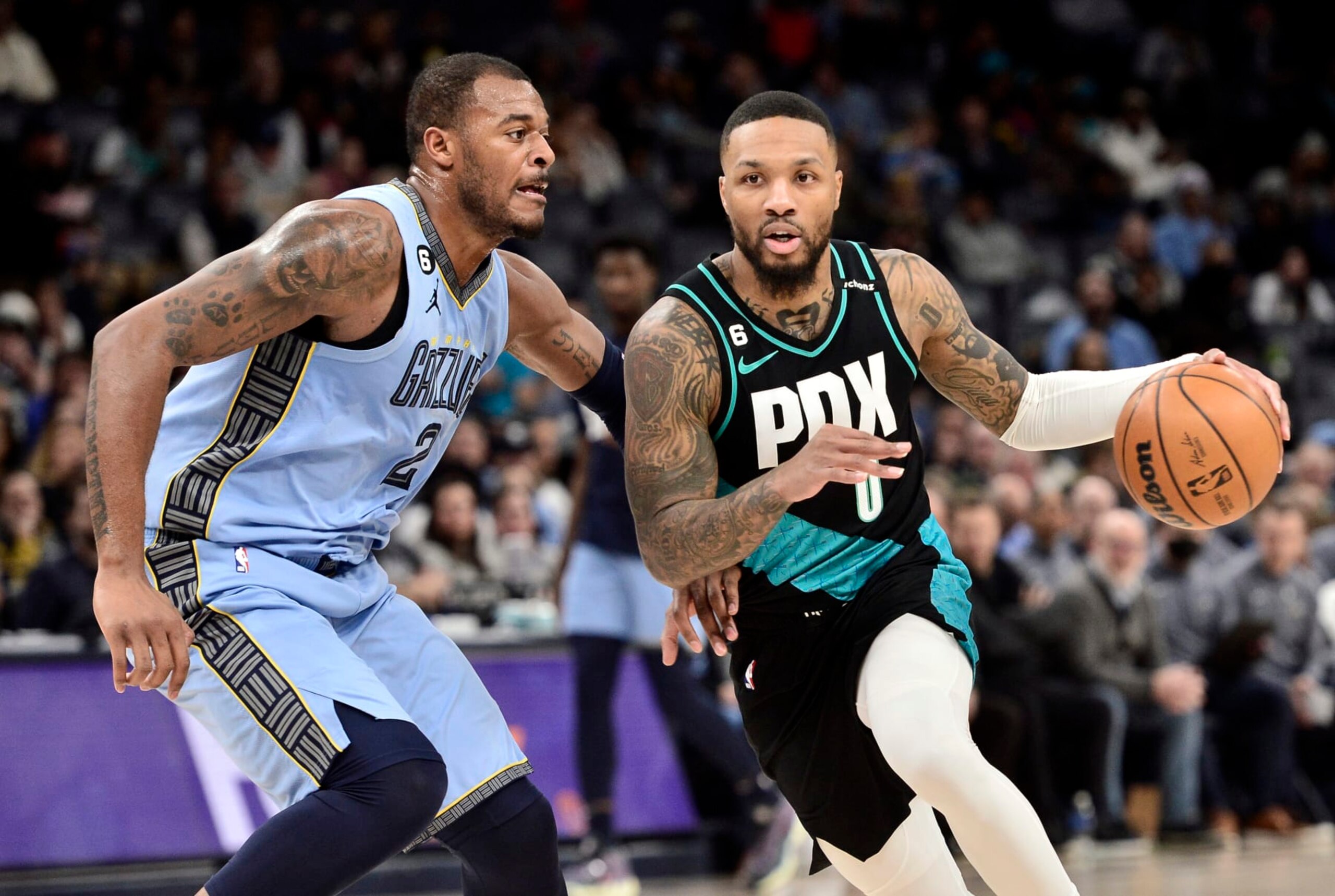 Xavier Tillman and Damian Lillard