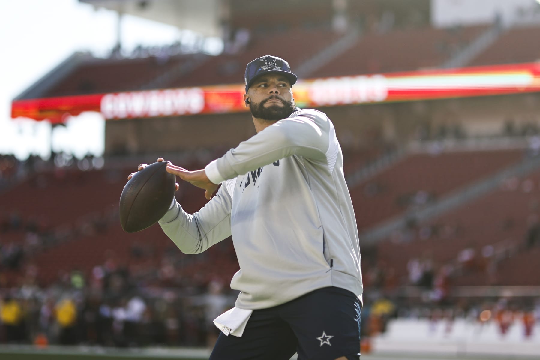 SANTA CLARA, CALIFORNIA - JANUARY 22: Dak Prescott #4 of the Dallas Cowboys passes as he warms up prior to an NFL divisional round playoff football game between the San Francisco 49ers and the Dallas Cowboys at Levi's Stadium on January 22, 2023 in Santa Clara, California. (Photo by Michael Owens/Getty Images)