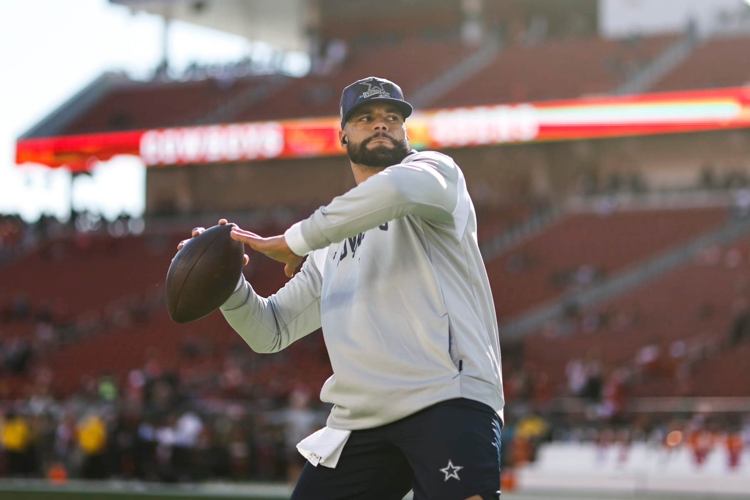 SANTA CLARA, CALIFORNIA - JANUARY 22: Dak Prescott #4 of the Dallas Cowboys passes as he warms up prior to an NFL divisional round playoff football game between the San Francisco 49ers and the Dallas Cowboys at Levi's Stadium on January 22, 2023 in Santa Clara, California. (Photo by Michael Owens/Getty Images) SANTA CLARA, CALIFORNIA - JANUARY 22: Dak Prescott #4 of the Dallas Cowboys passes as he warms up prior to an NFL divisional round playoff football game between the San Francisco 49ers and the Dallas Cowboys at Levi's Stadium on January 22, 2023 in Santa Clara, California. (Photo by Michael Owens/Getty Images)