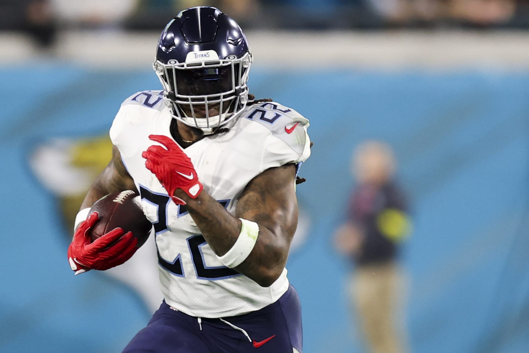JACKSONVILLE, FLORIDA - JANUARY 07: Derrick Henry #22 of the Tennessee Titans runs the ball during the first quarter against the Jacksonville Jaguars at TIAA Bank Field on January 07, 2023 in Jacksonville, Florida. (Photo by Mike Carlson/Getty Images)