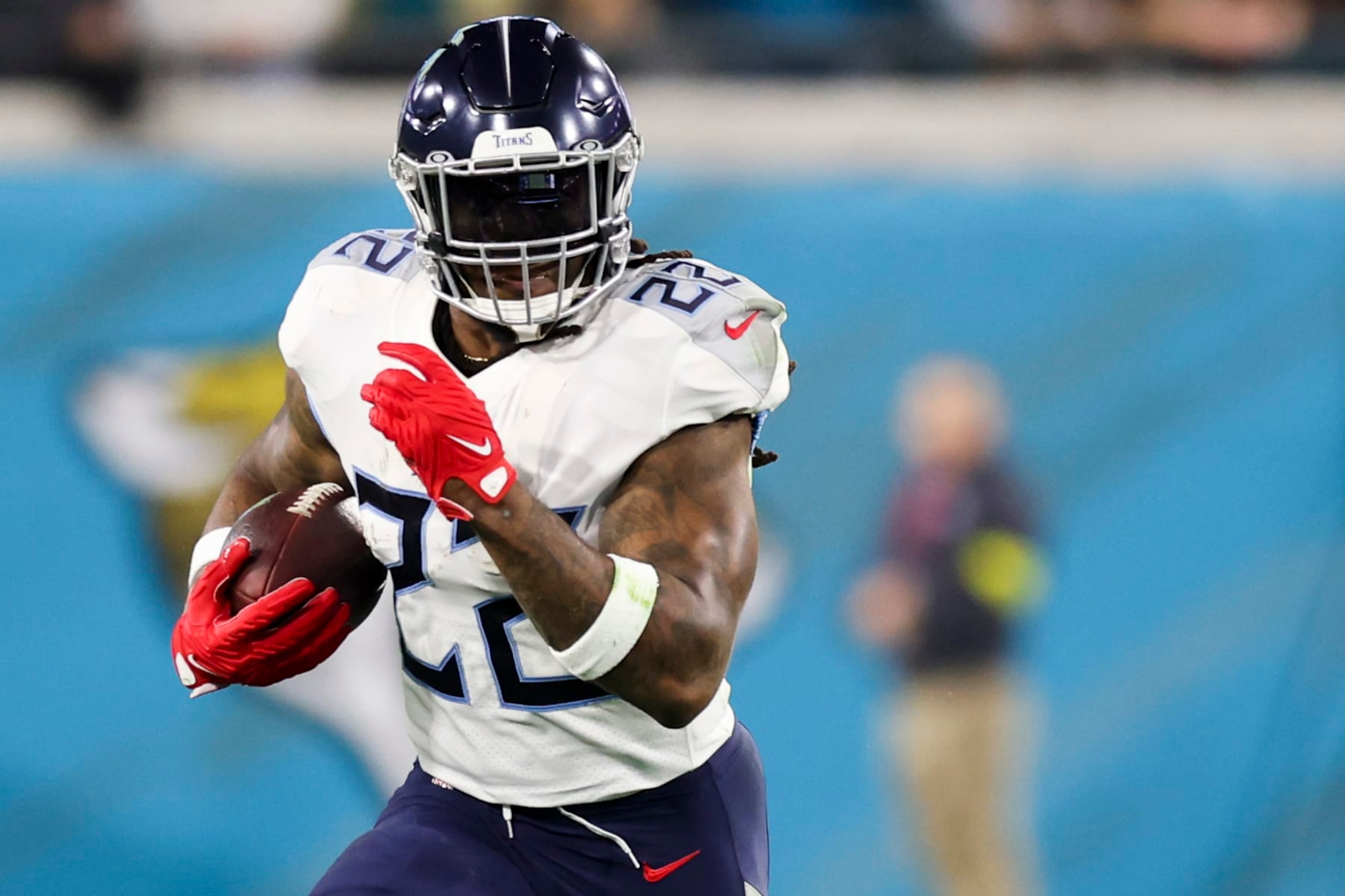 JACKSONVILLE, FLORIDA - JANUARY 07: Derrick Henry #22 of the Tennessee Titans runs the ball during the first quarter against the Jacksonville Jaguars at TIAA Bank Field on January 07, 2023 in Jacksonville, Florida. (Photo by Mike Carlson/Getty Images) JACKSONVILLE, FLORIDA - JANUARY 07: Derrick Henry #22 of the Tennessee Titans runs the ball during the first quarter against the Jacksonville Jaguars at TIAA Bank Field on January 07, 2023 in Jacksonville, Florida. (Photo by Mike Carlson/Getty Images)