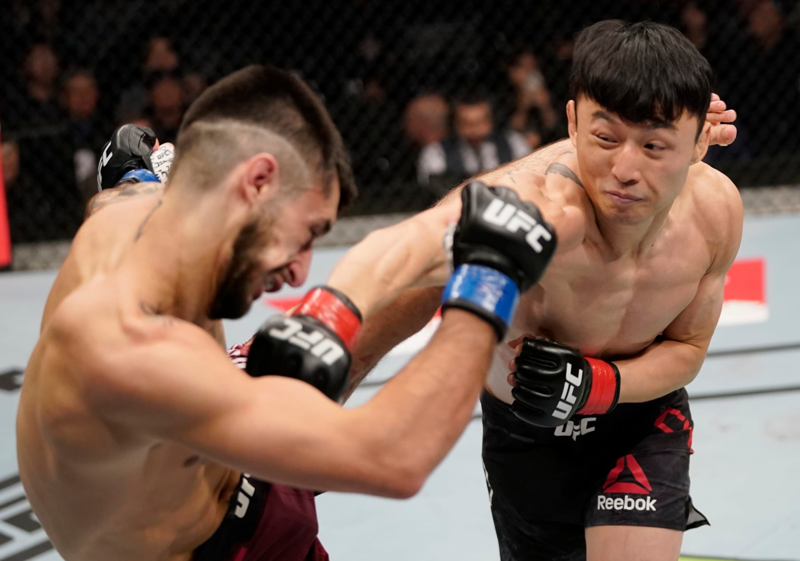 Dooho Choi lands a right hand against Charles Jourdain. 