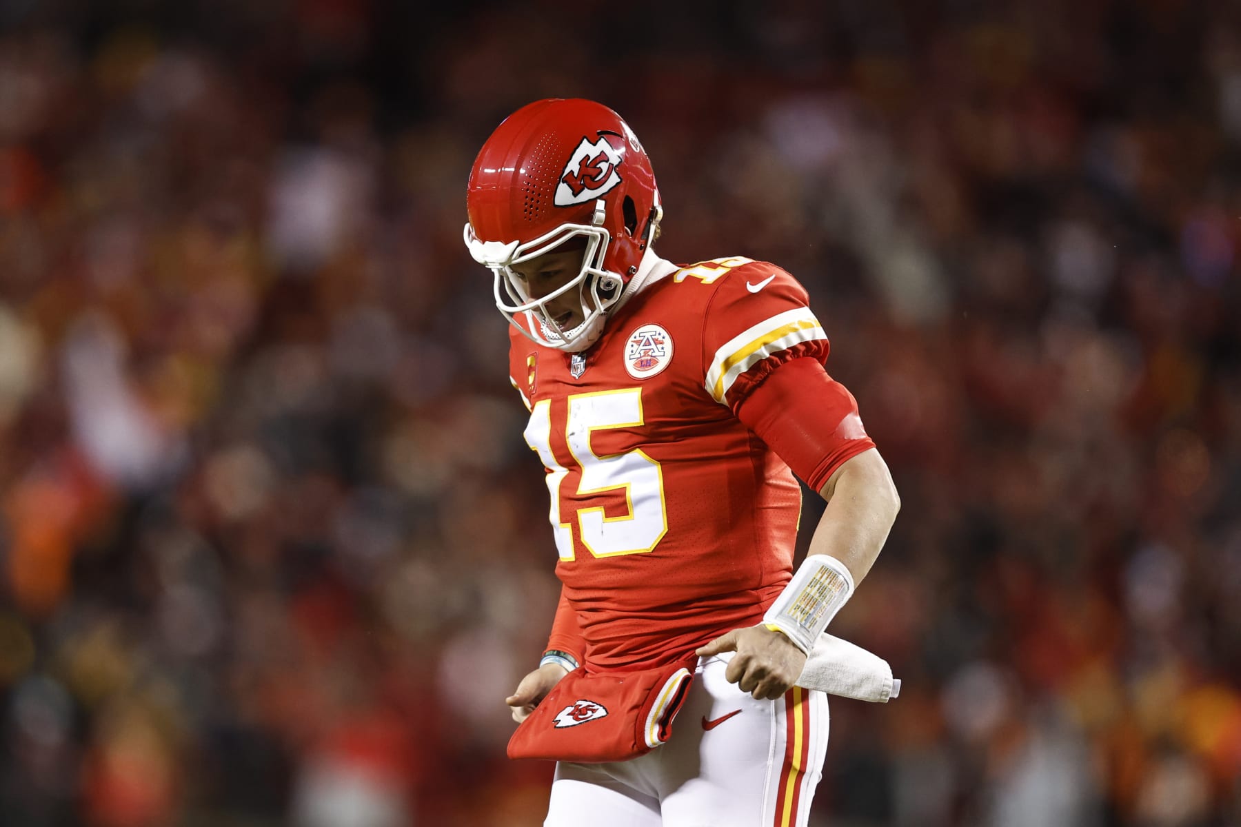 KANSAS CITY, MISSOURI - JANUARY 29: Patrick Mahomes #15 of the Kansas City Chiefs reacts as he runs off the field after passing for a touchdown during the AFC Championship NFL football game between the Kansas City Chiefs and the Cincinnati Bengals at GEHA Field at Arrowhead Stadium on January 29, 2023 in Kansas City, Missouri. (Photo by Michael Owens/Getty Images)