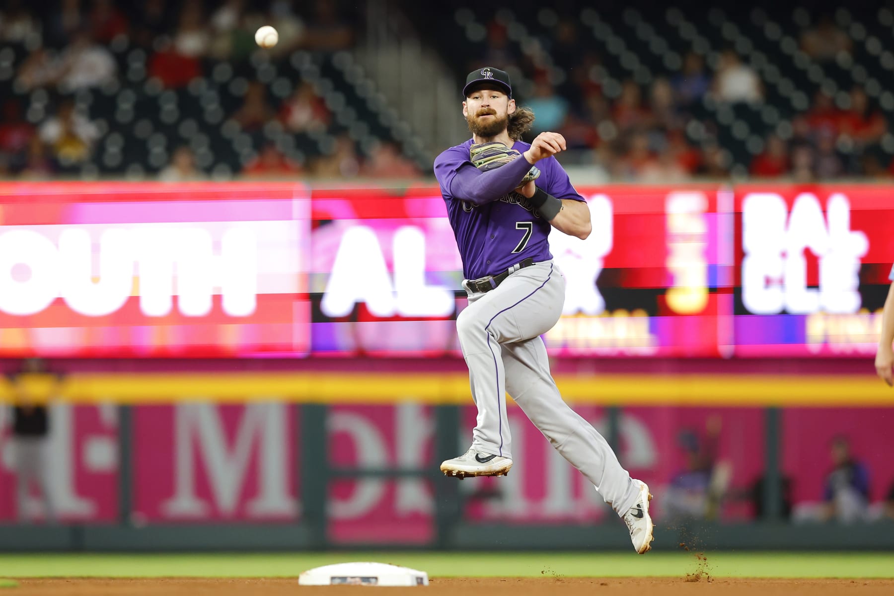ATLANTA, GA - AUGUST 31: Brendan Rodgers #7 of the Colorado Rockies throws to first during the seventh inning against the Atlanta Braves at Truist Park on August 31, 2022 in Atlanta, Georgia. (Photo by Todd Kirkland/Getty Images)