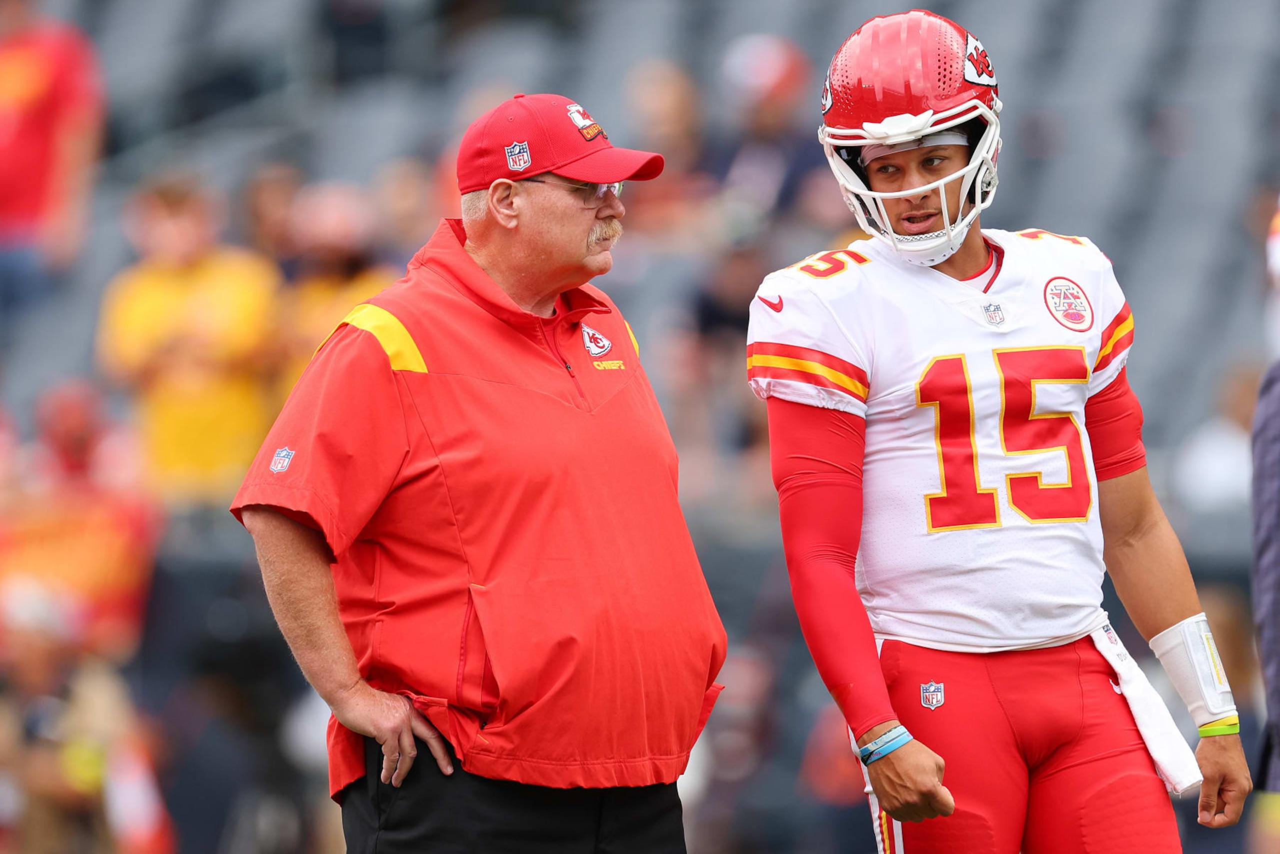 CHICAGO, ILLINOIS - AUGUST 13: Head coach Andy Reid and Patrick Mahomes #15 of the Kansas City Chiefs talk prior to a preseason game against the Chicago Bears at Soldier Field on August 13, 2022 in Chicago, Illinois. (Photo by Michael Reaves/Getty Images)