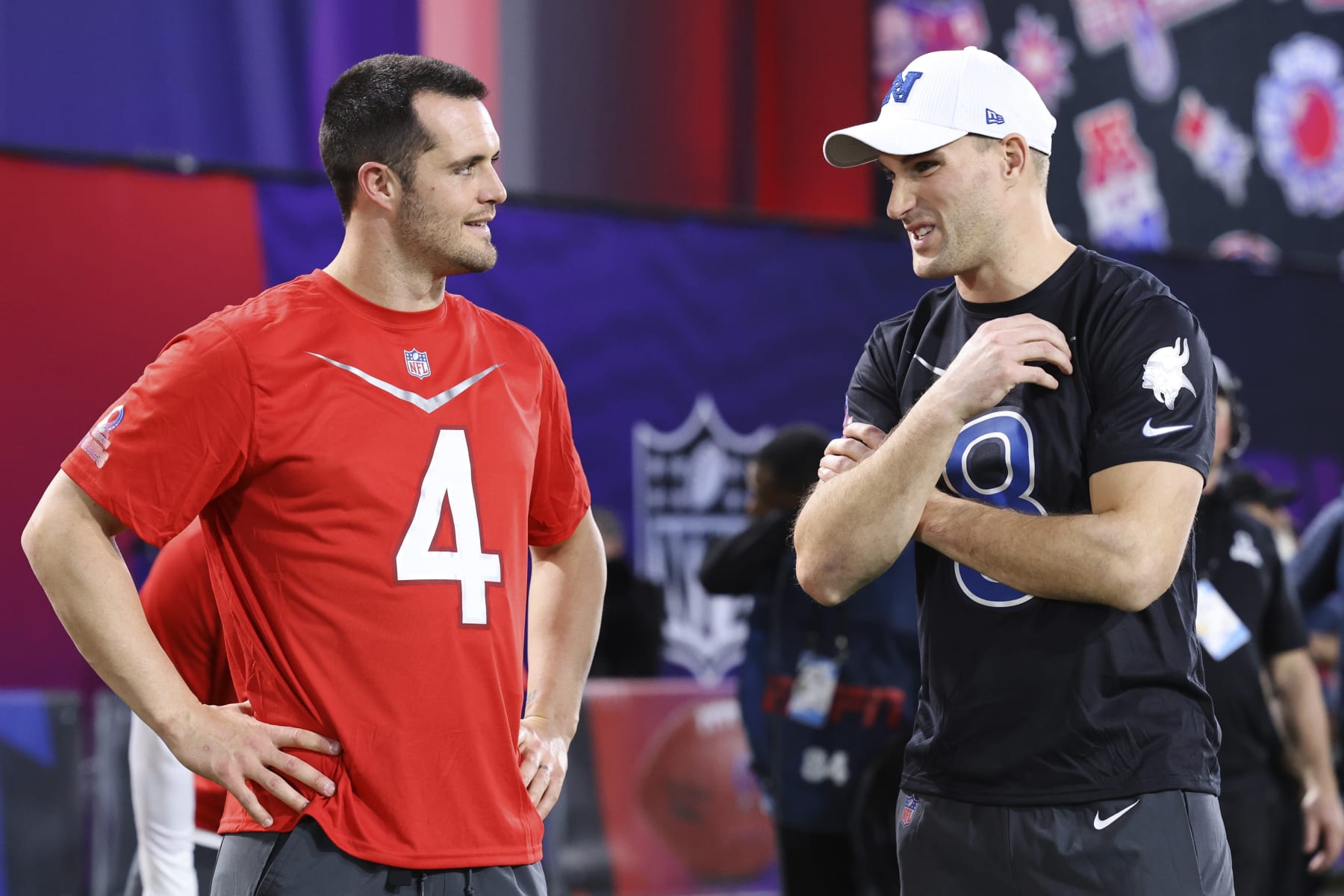 AFC quarterback Derek Carr (4) of the Las Vegas Raiders speaks with NFC quarterback Kirk Cousins (8) of the Minnesota Vikings before the Pro Bowl Games skills events, Thursday, Feb. 2, 2023, in Henderson, Nev. (Gregory Payan/AP Images for NFL)