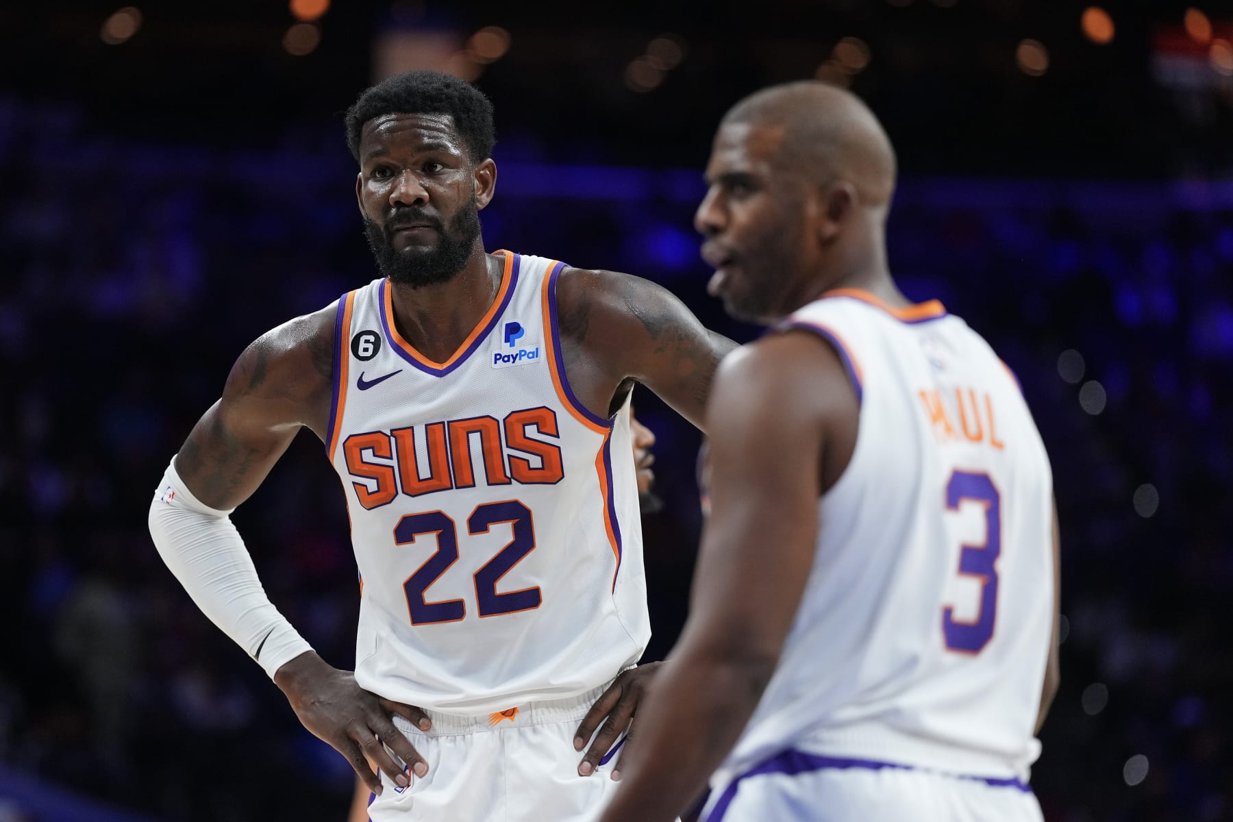 PHILADELPHIA, PA - NOVEMBER 07: Deandre Ayton #22 and Chris Paul #3 of the Phoenix Suns look on against the Philadelphia 76ers at the Wells Fargo Center on November 7, 2022 in Philadelphia, Pennsylvania. The 76ers defeated the Suns 100-88. NOTE TO USER: User expressly acknowledges and agrees that, by downloading and or using this photograph, User is consenting to the terms and conditions of the Getty Images License Agreement. (Photo by Mitchell Leff/Getty Images)