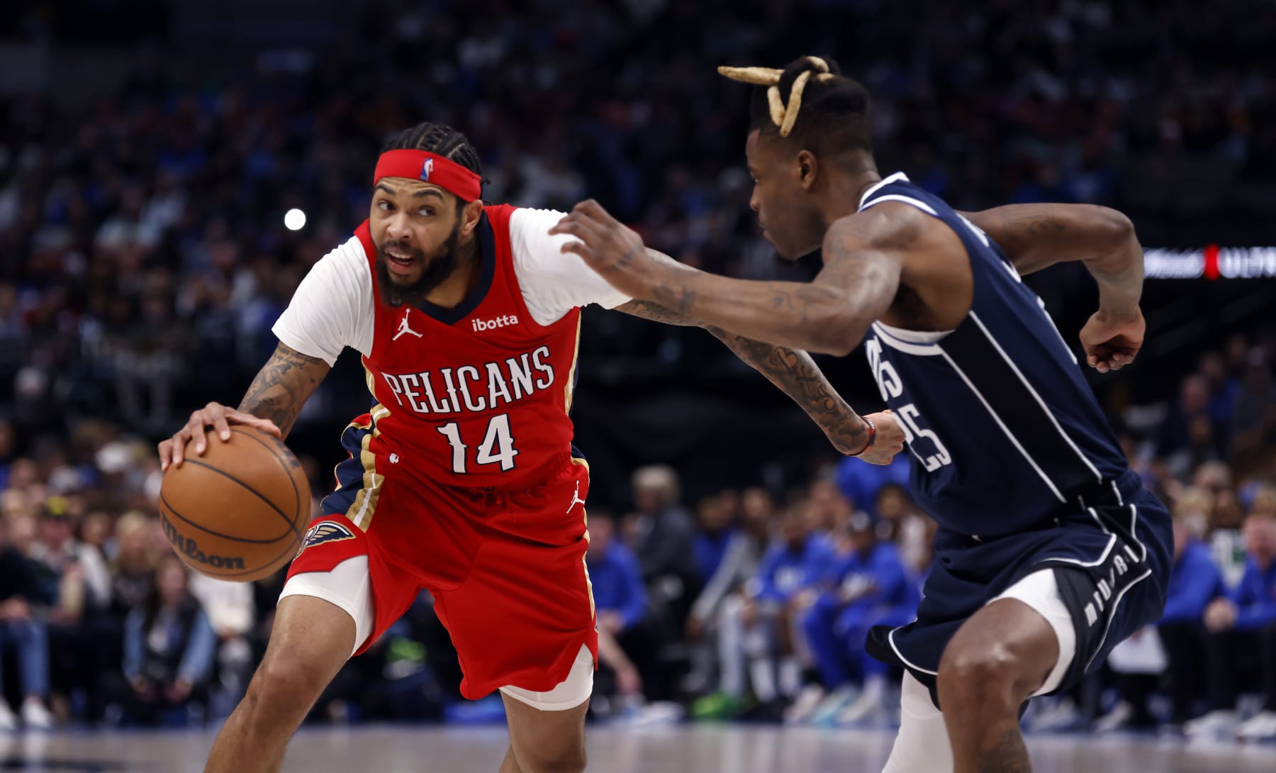 DALLAS, TX - FEBRUARY 2: Brandon Ingram #14 of the New Orleans Pelicans goes the basket against Reggie Bullock #25 of the Dallas Mavericks in the second half at American Airlines Center on February 2, 2023 in Dallas, Texas. The Mavericks won 111-106. NOTE TO USER: User expressly acknowledges and agrees that, by downloading and or using this photograph, user is consenting to the terms and conditions of the Getty Images License Agreement. (Photo by Ron Jenkins/Getty Images)