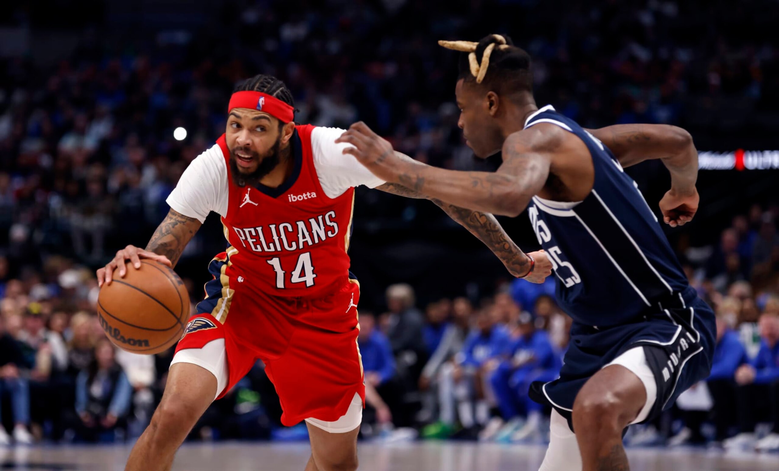 DALLAS, TX - FEBRUARY 2: Brandon Ingram #14 of the New Orleans Pelicans goes the basket against Reggie Bullock #25 of the Dallas Mavericks in the second half at American Airlines Center on February 2, 2023 in Dallas, Texas. The Mavericks won 111-106. NOTE TO USER: User expressly acknowledges and agrees that, by downloading and or using this photograph, user is consenting to the terms and conditions of the Getty Images License Agreement. (Photo by Ron Jenkins/Getty Images)
