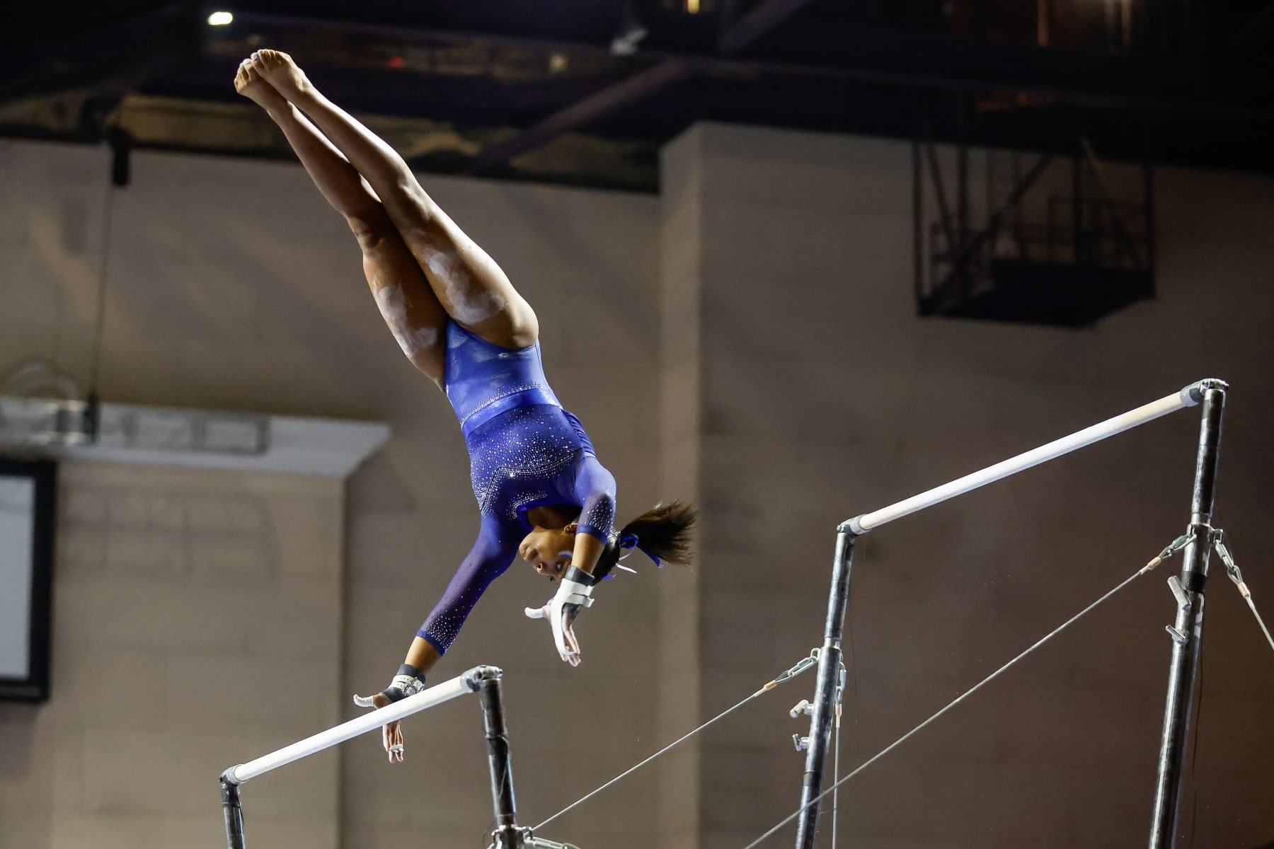 Morgan Price competing on the uneven bars. 