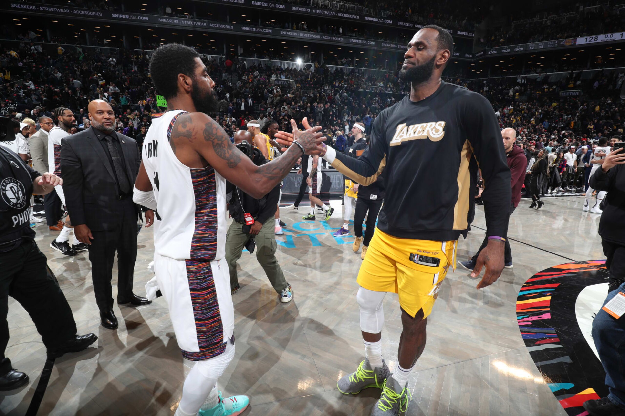 BROOKLYN, NY - JANUARY 23: Kyrie Irving #11 of the Brooklyn Nets and LeBron James #23 of the Los Angeles Lakers hi-five after a game on January 23, 2020 at Barclays Center in Brooklyn, New York. NOTE TO USER: User expressly acknowledges and agrees that, by downloading and or using this Photograph, user is consenting to the terms and conditions of the Getty Images License Agreement. Mandatory Copyright Notice: Copyright 2020 NBAE (Photo by Nathaniel S. Butler/NBAE via Getty Images)