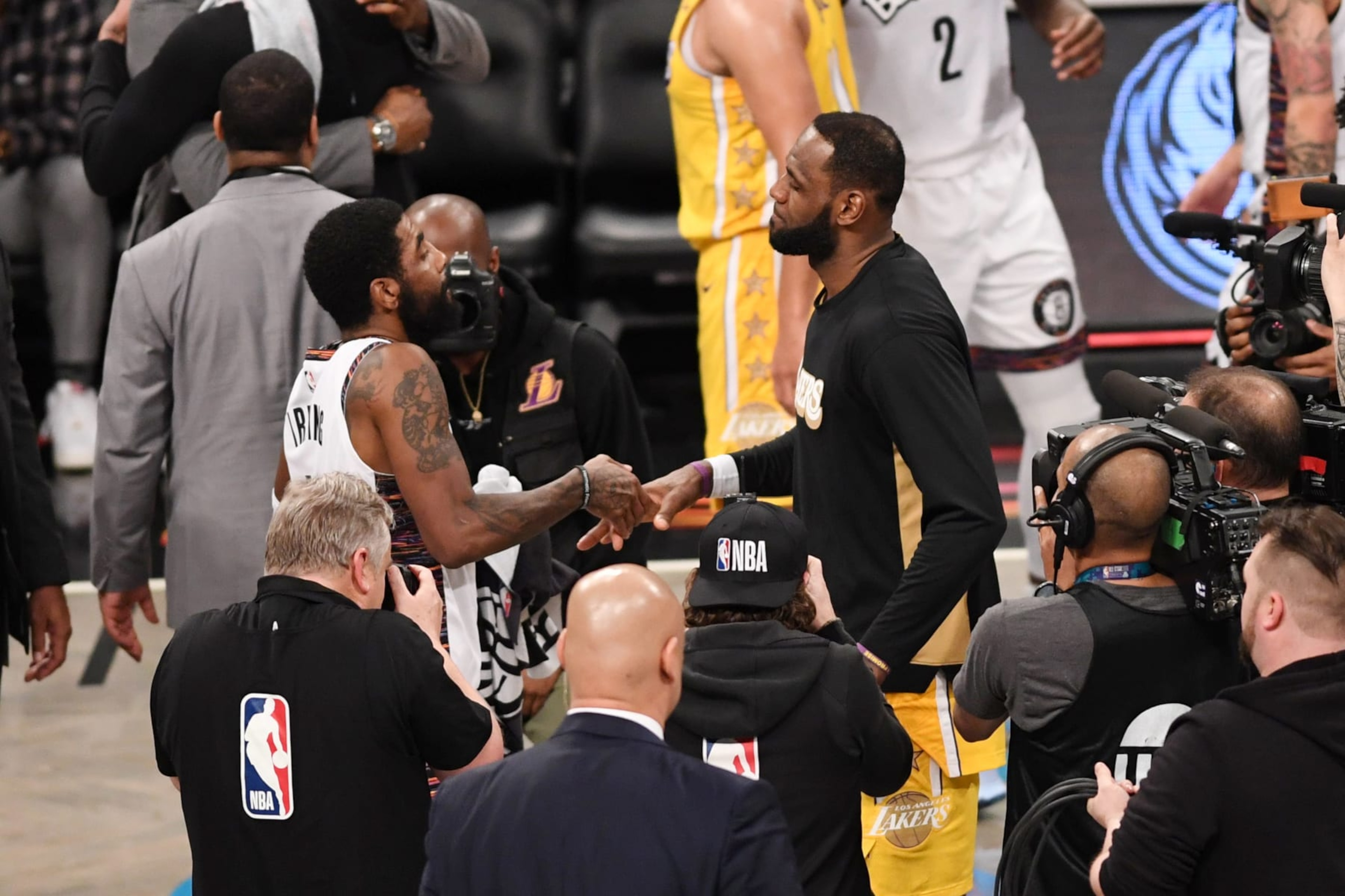 NEW YORK, NEW YORK - JANUARY 23: LeBron James #23 of the Los Angeles Lakers with Kyrie Irving #11 after the game against the Brooklyn Nets at Barclays Center on January 23, 2020 in New York City. NOTE TO USER: User expressly acknowledges and agrees that, by downloading and or using this photograph, User is consenting to the terms and conditions of the Getty Images License Agreement. (Photo by Matteo Marchi/Getty Images)