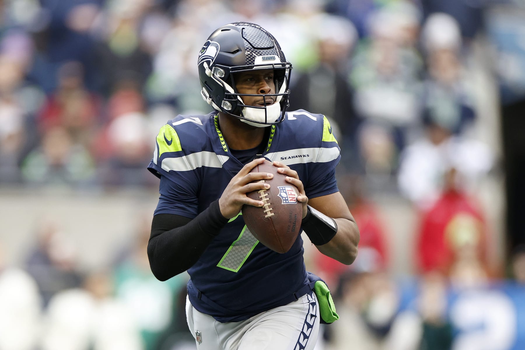 SEATTLE, WASHINGTON - JANUARY 01: Geno Smith #7 of the Seattle Seahawks looks to pass against the New York Jets during the second quarter at Lumen Field on January 01, 2023 in Seattle, Washington. (Photo by Steph Chambers/Getty Images)
