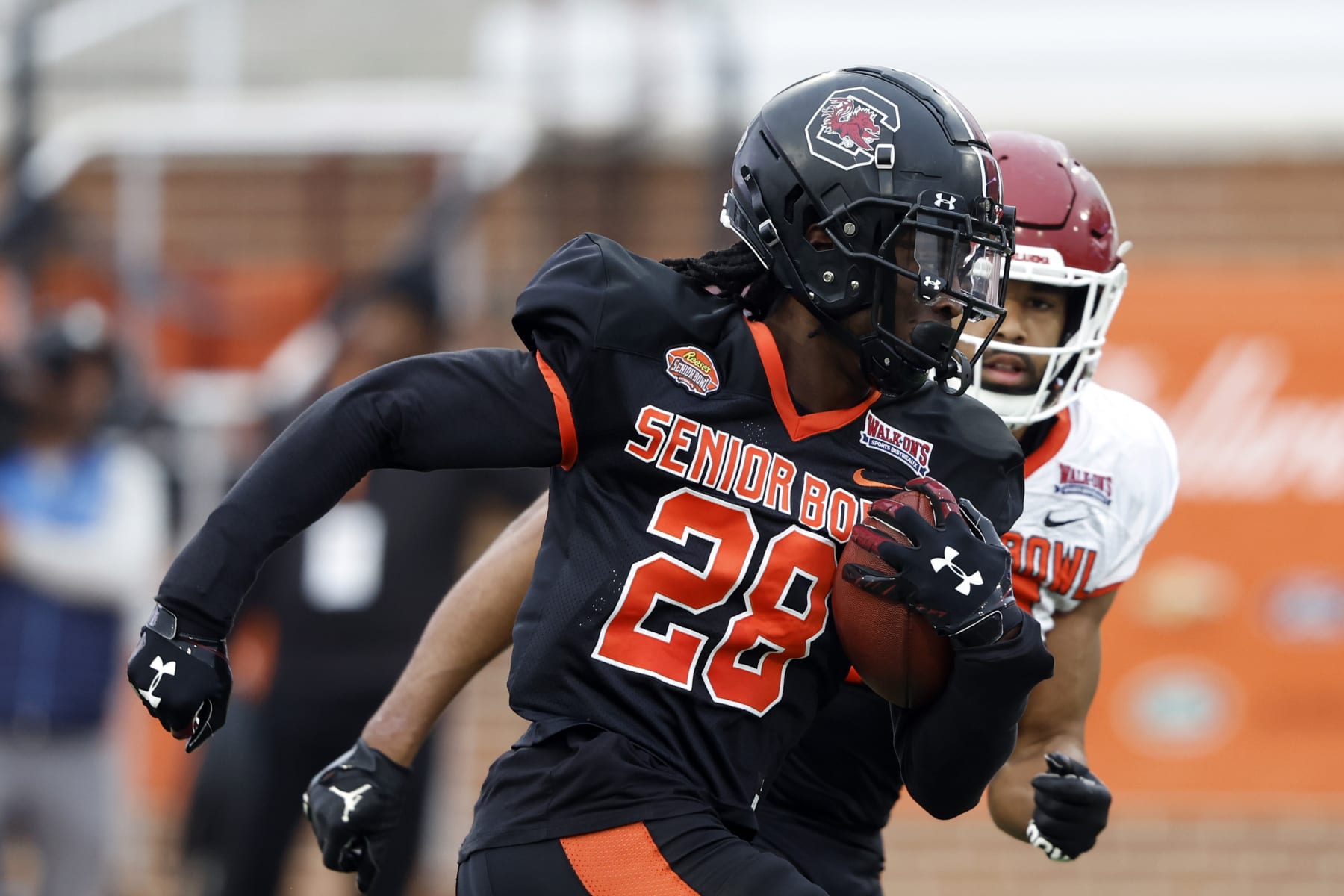 American defensive back Darius Rush of South Carolina (28) runs through drills during practice for the Senior Bowl NCAA college football game Thursday, Feb. 2, 2023, in Mobile, Ala.. (AP Photo/Butch Dill)