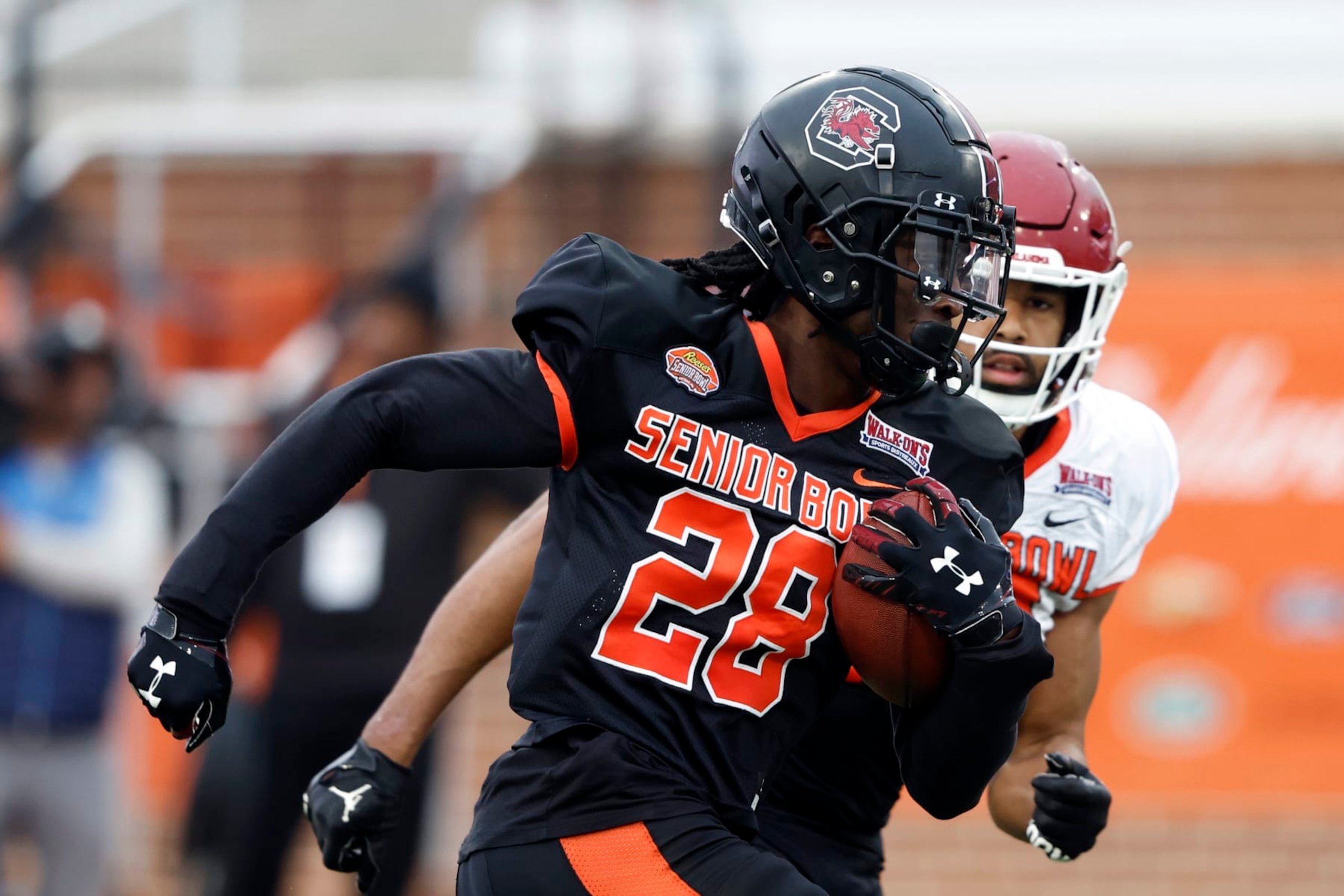 American defensive back Darius Rush of South Carolina (28) runs through drills during practice for the Senior Bowl NCAA college football game Thursday, Feb. 2, 2023, in Mobile, Ala.. (AP Photo/Butch Dill)