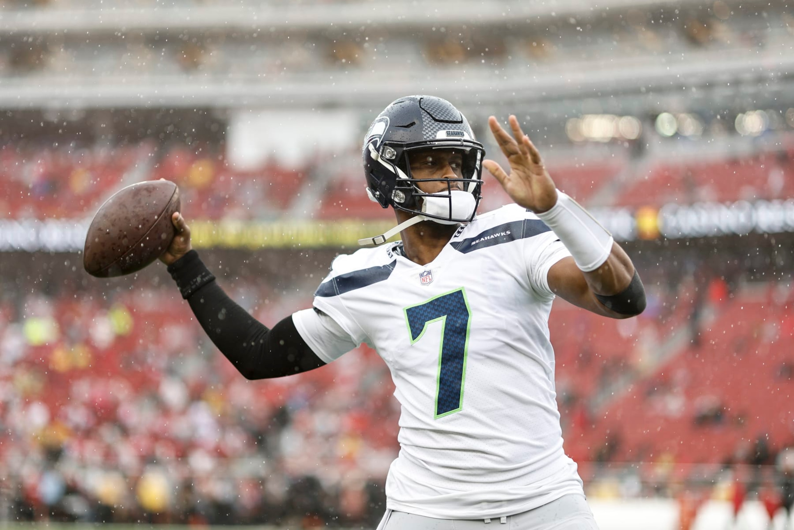 SANTA CLARA, CALIFORNIA - JANUARY 14: Geno Smith #7 of the Seattle Seahawks passes as he warms up prior to an NFL football game between the San Francisco 49ers and the Seattle Seahawks at Levi's Stadium on January 14, 2023 in Santa Clara, California. (Photo by Michael Owens/Getty Images) SANTA CLARA, CALIFORNIA - JANUARY 14: Geno Smith #7 of the Seattle Seahawks passes as he warms up prior to an NFL football game between the San Francisco 49ers and the Seattle Seahawks at Levi's Stadium on January 14, 2023 in Santa Clara, California. (Photo by Michael Owens/Getty Images)